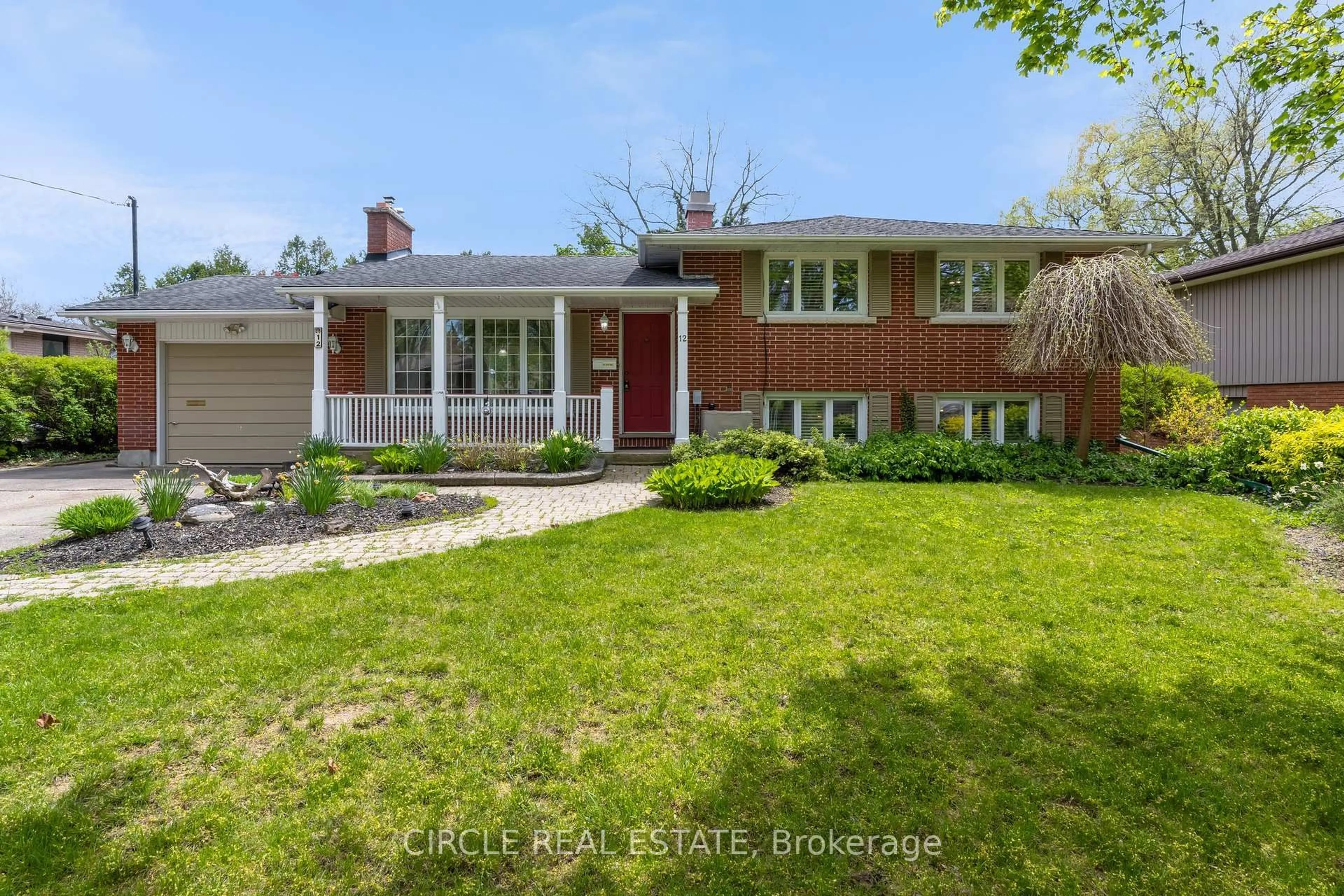 Home with brick exterior material, street for 12 Old Coach Rd, St. Catharines Ontario L2N 2P3