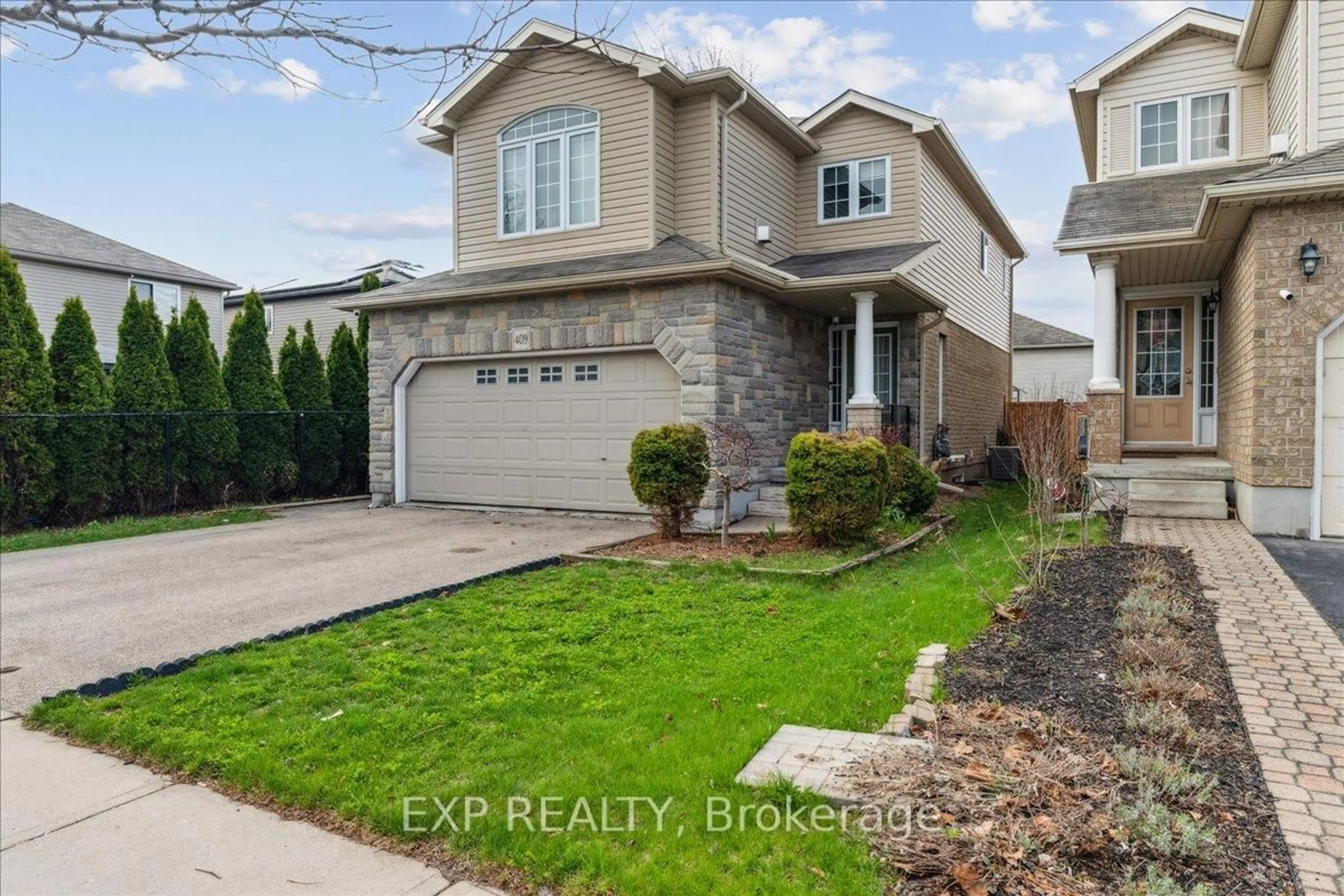 Home with vinyl exterior material, street for 409 Tealby Cres, Waterloo Ontario N2J 4Y8