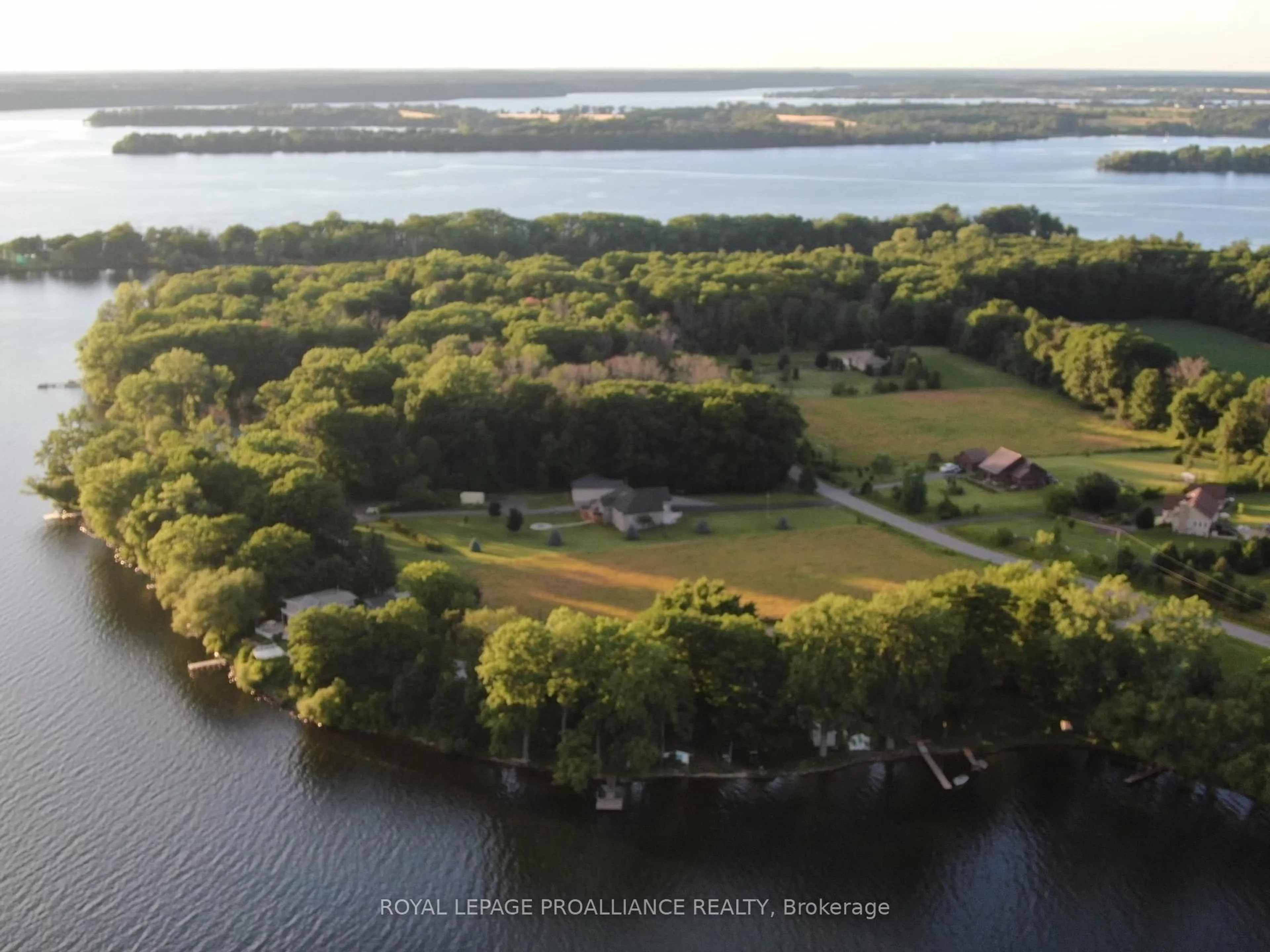 A pic from outside/outdoor area/front of a property/back of a property/a pic from drone, water/lake/river/ocean view for 32 Quinte View Rd, Bath Ontario K0H 1G0