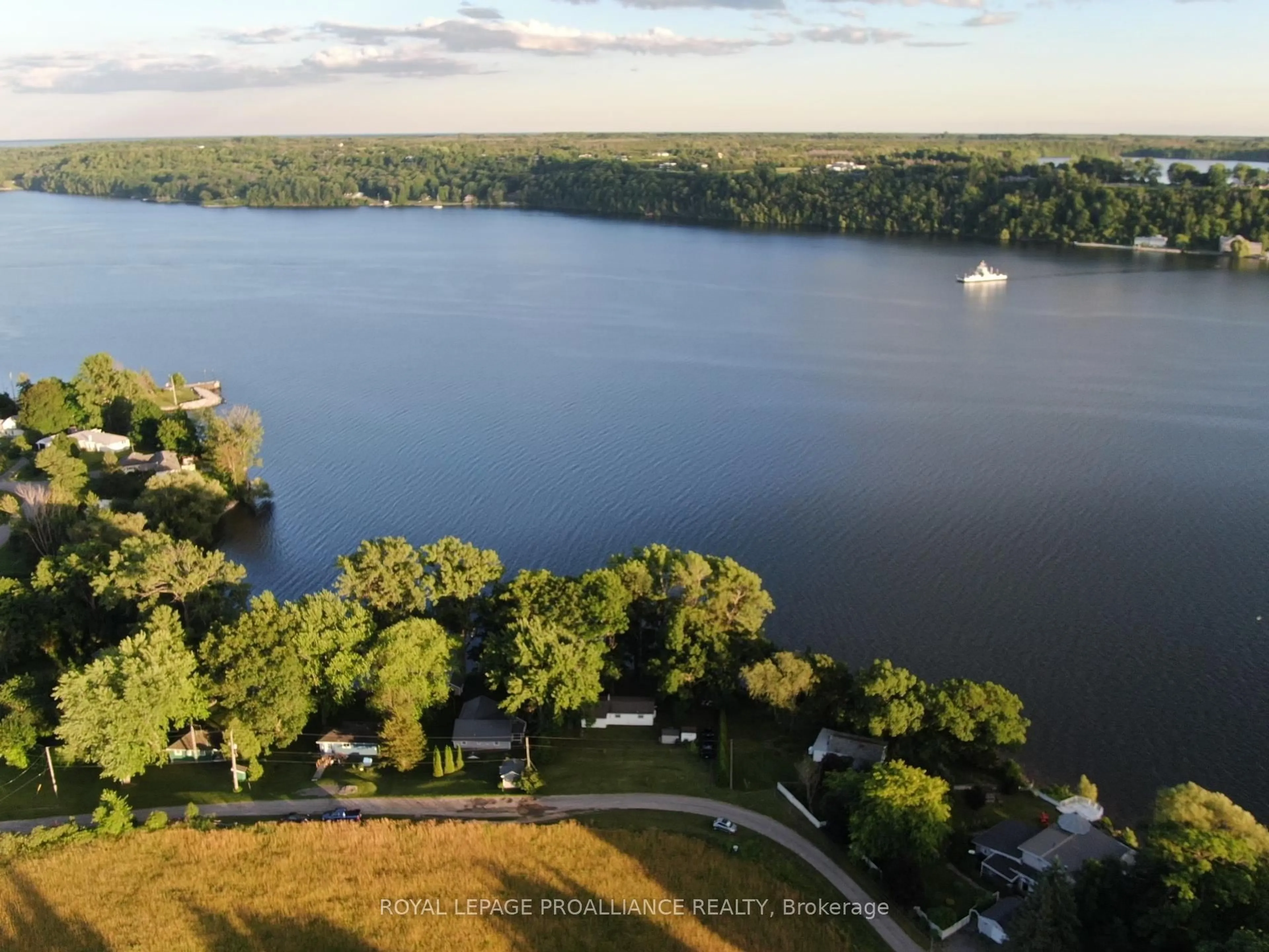 A pic from outside/outdoor area/front of a property/back of a property/a pic from drone, water/lake/river/ocean view for 32 Quinte View Rd, Bath Ontario K0H 1G0