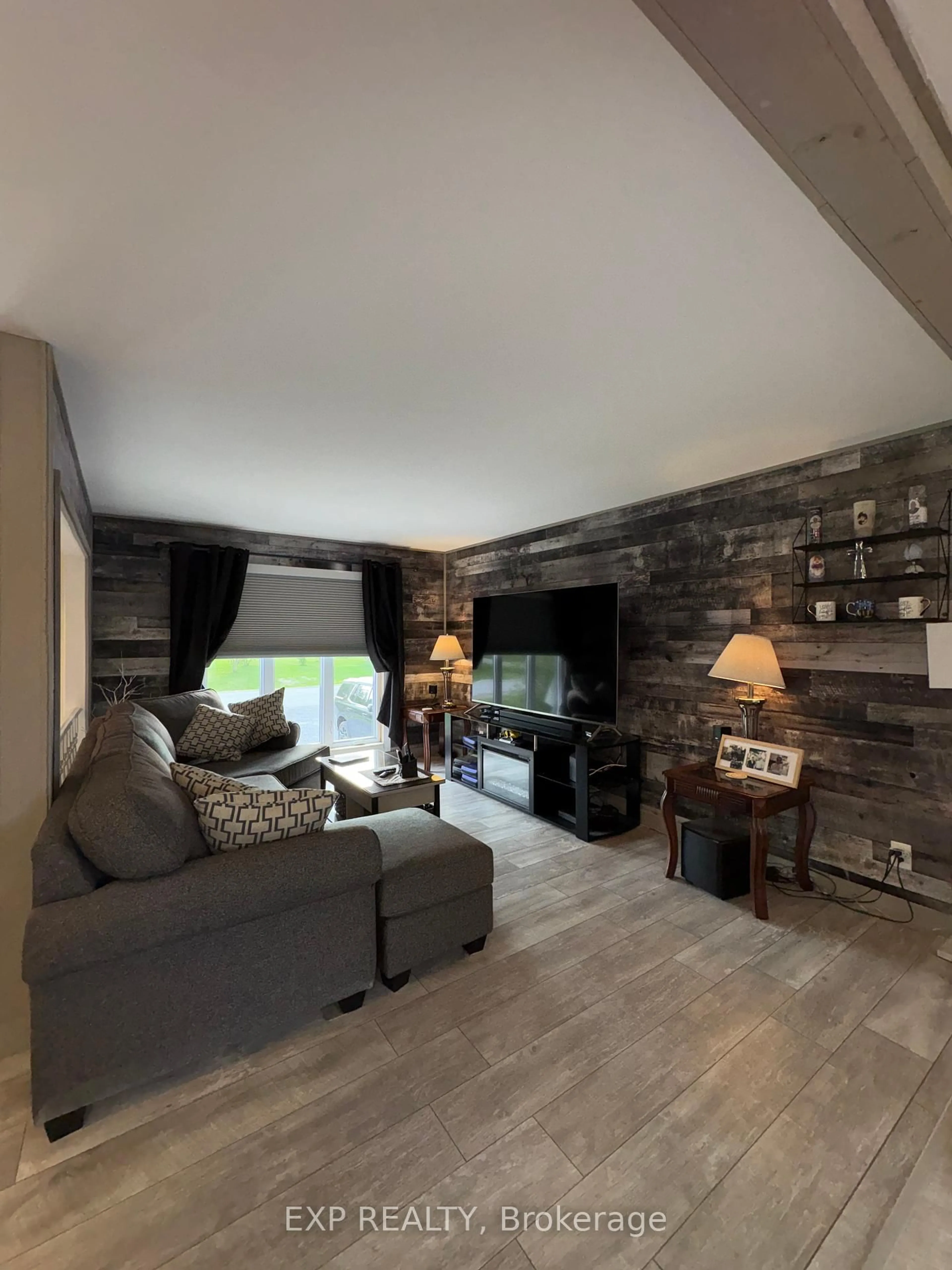 Living room with furniture, wood/laminate floor for 1107 De La Foret Prom, Clarence-Rockland Ontario K4K 1K9