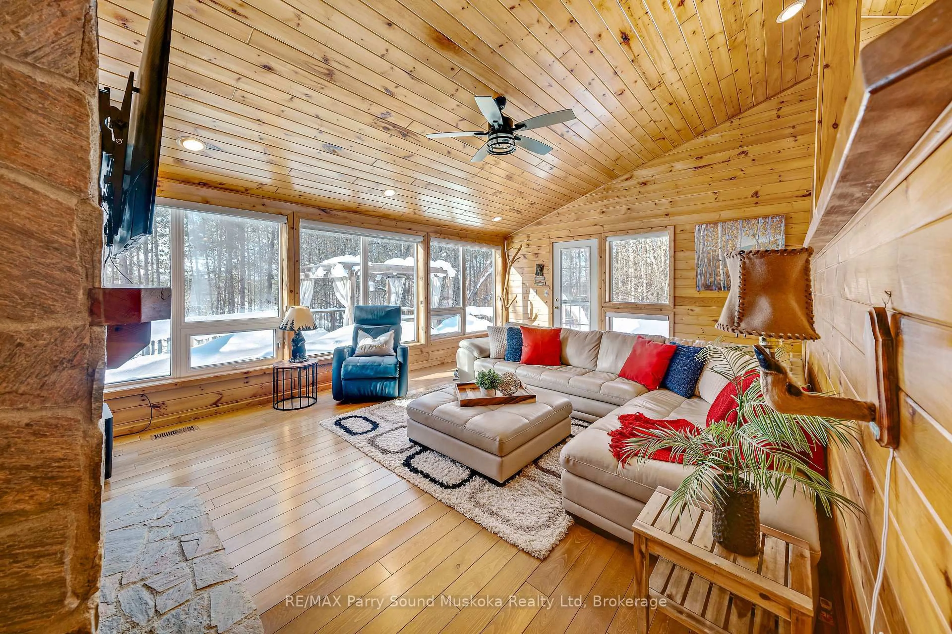 Living room with furniture, wood/laminate floor for 587 Centre Rd, McKellar Ontario P2A 0B4