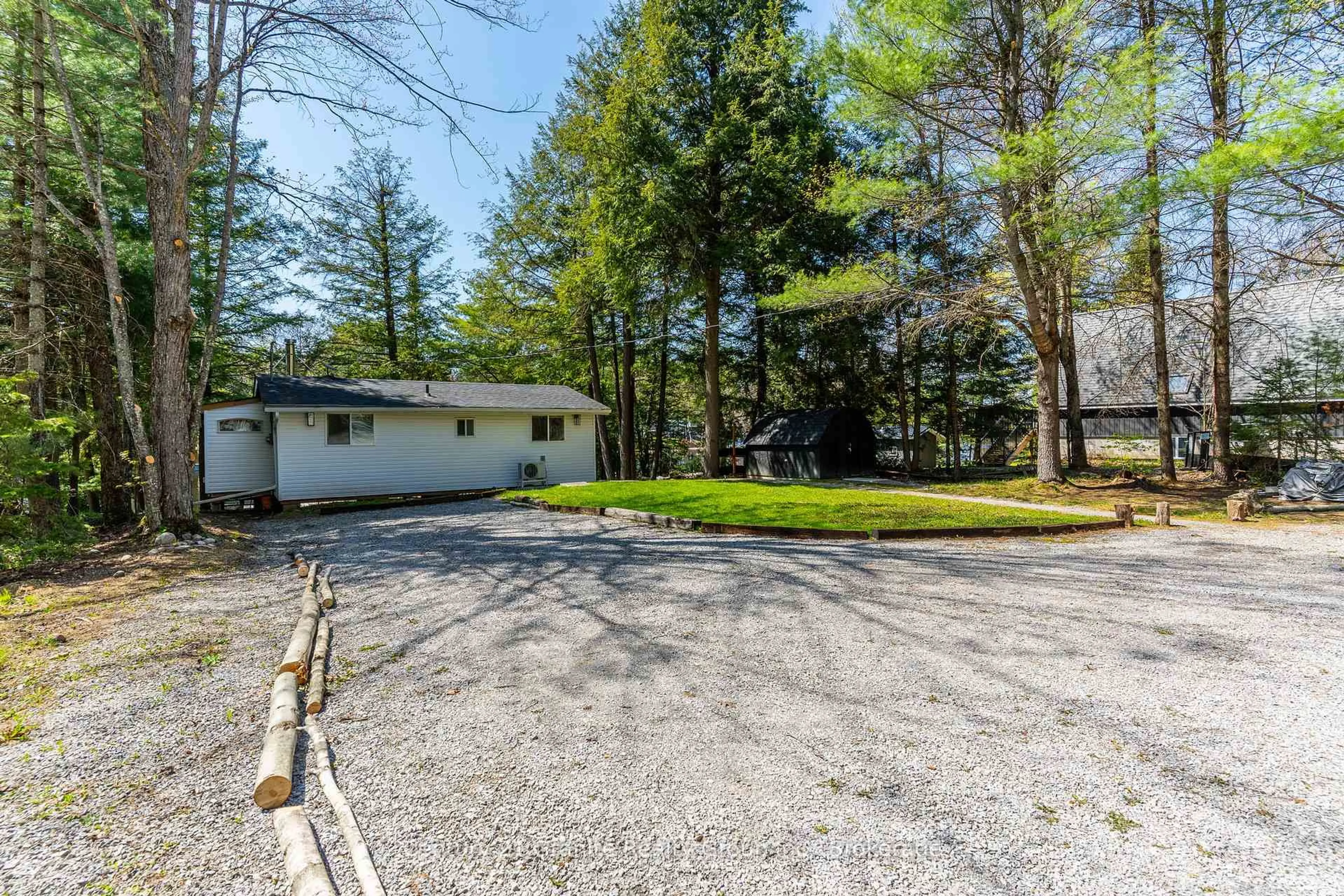 A pic from outside/outdoor area/front of a property/back of a property/a pic from drone, unknown for 1954 South Beaver Lake Lane, Minden Hills Ontario K0M 2K0