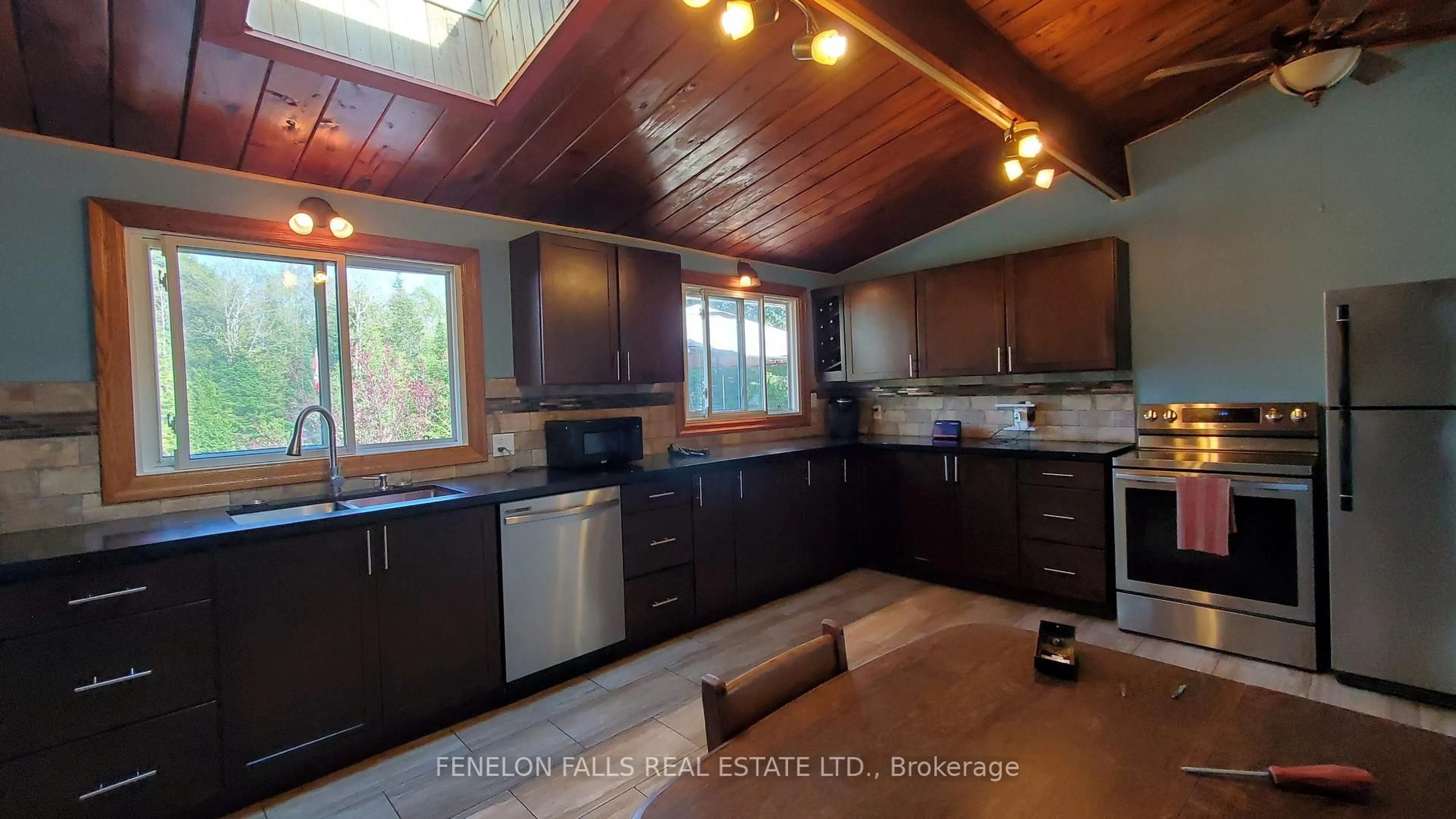 Open concept kitchen, wood/laminate floor for 105 Cedarplank Rd, Kawartha Lakes Ontario K0M 1N0