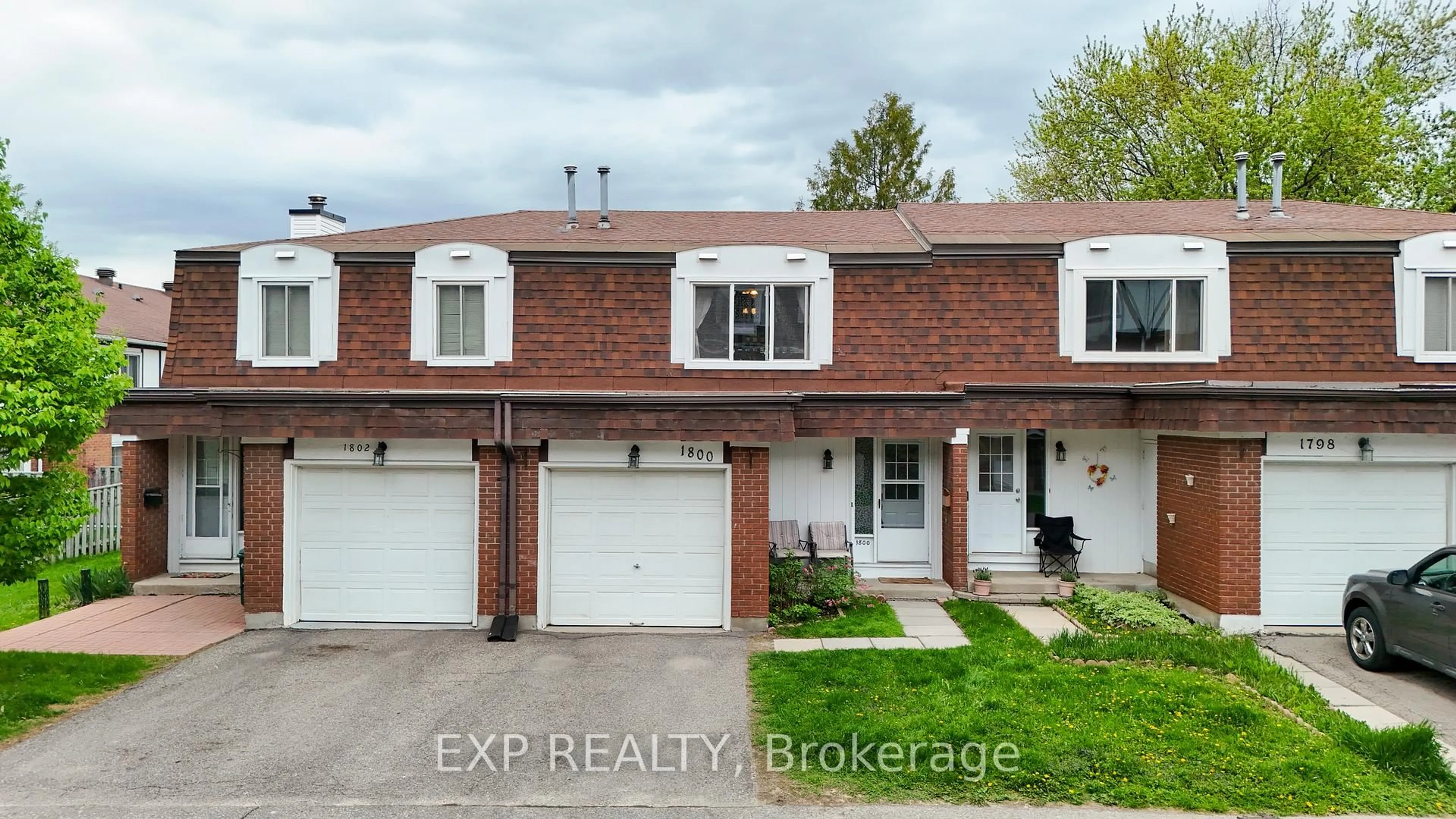 Home with brick exterior material, street for 1800 AXMINSTER Crt, Ottawa Ontario K1C 1Z5