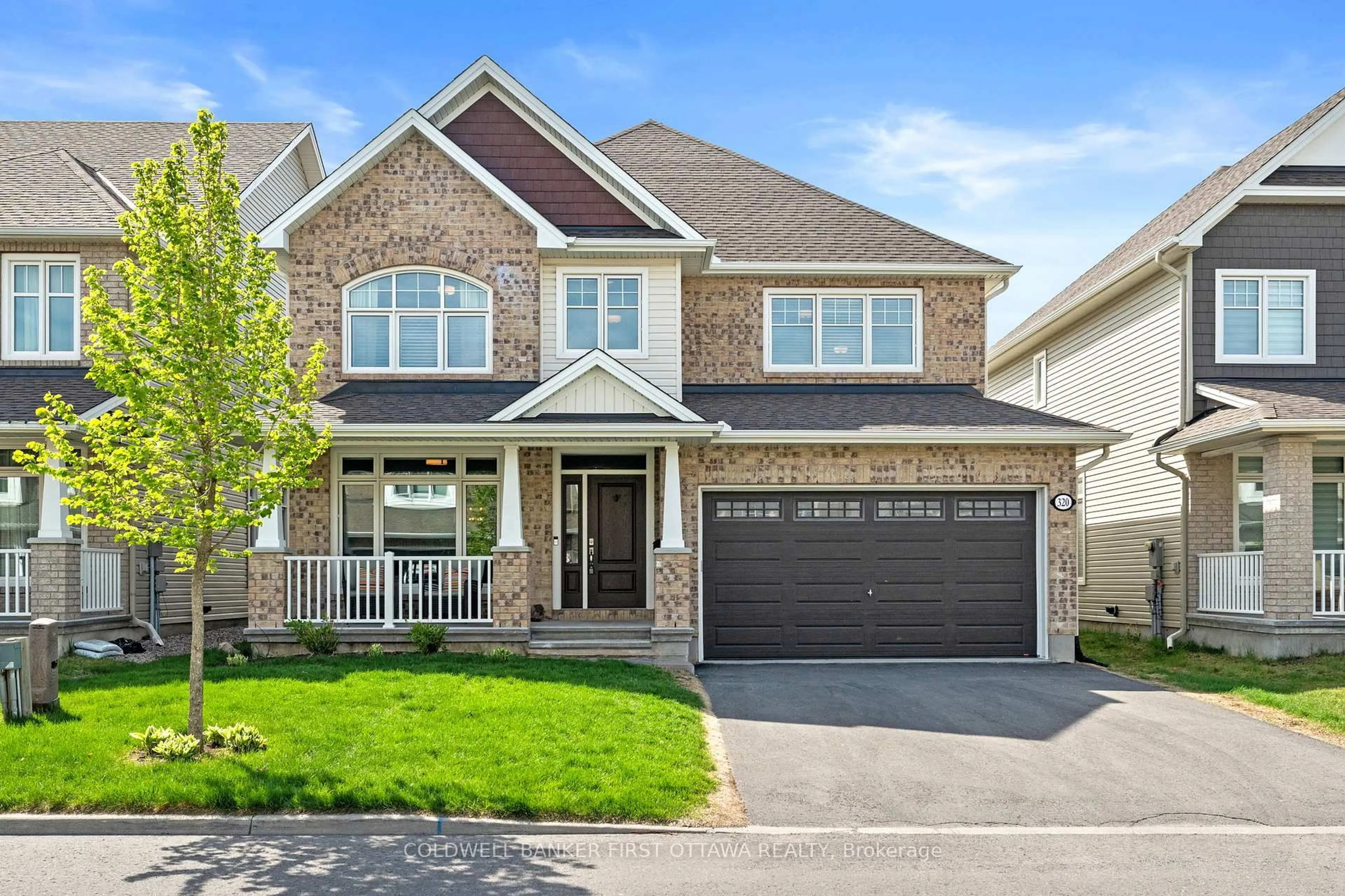 Home with brick exterior material, street for 320 Brambling Way, Ottawa Ontario K2J 6E4
