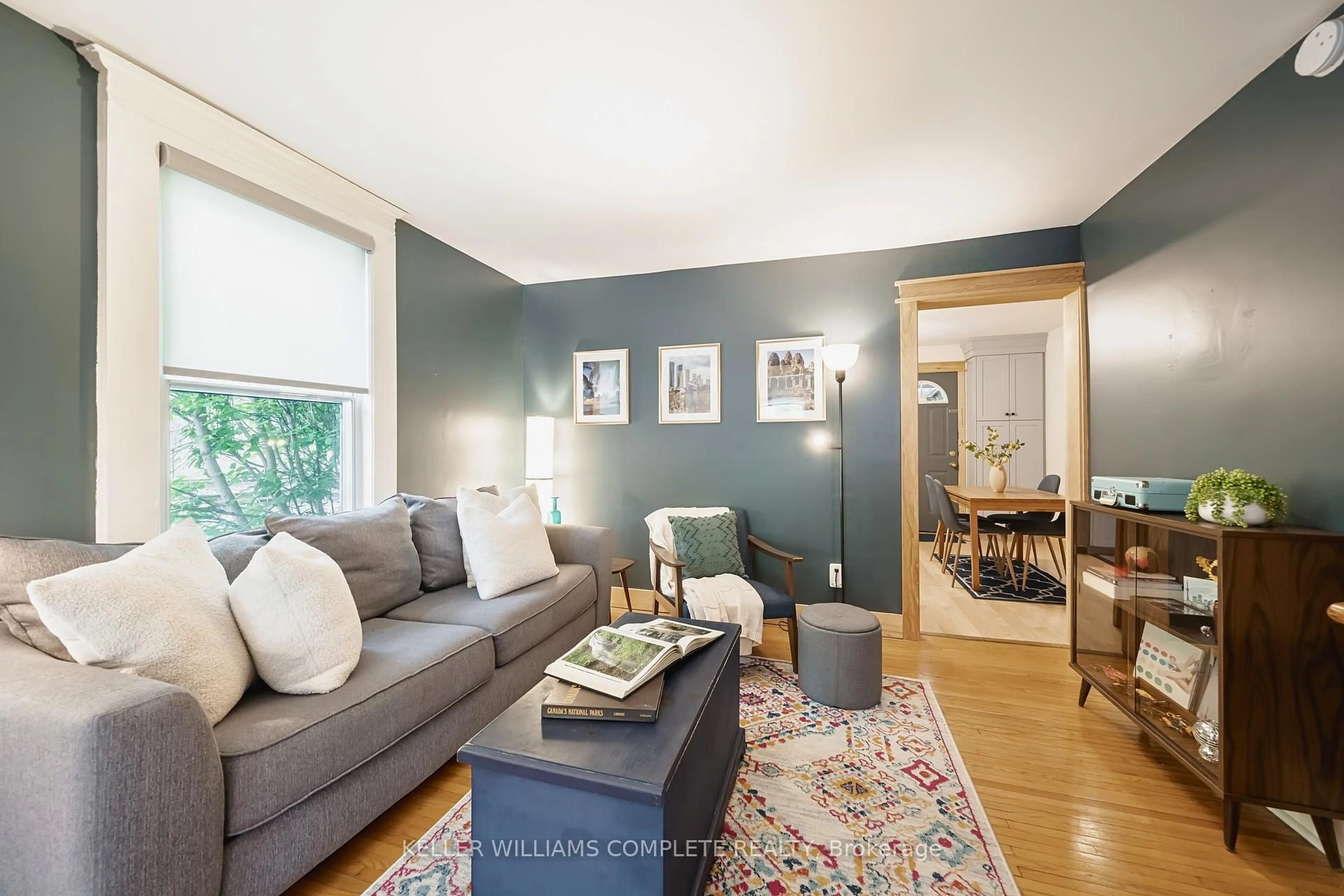 Living room with furniture, wood/laminate floor for 264 Holton Ave, Hamilton Ontario L8M 2L9