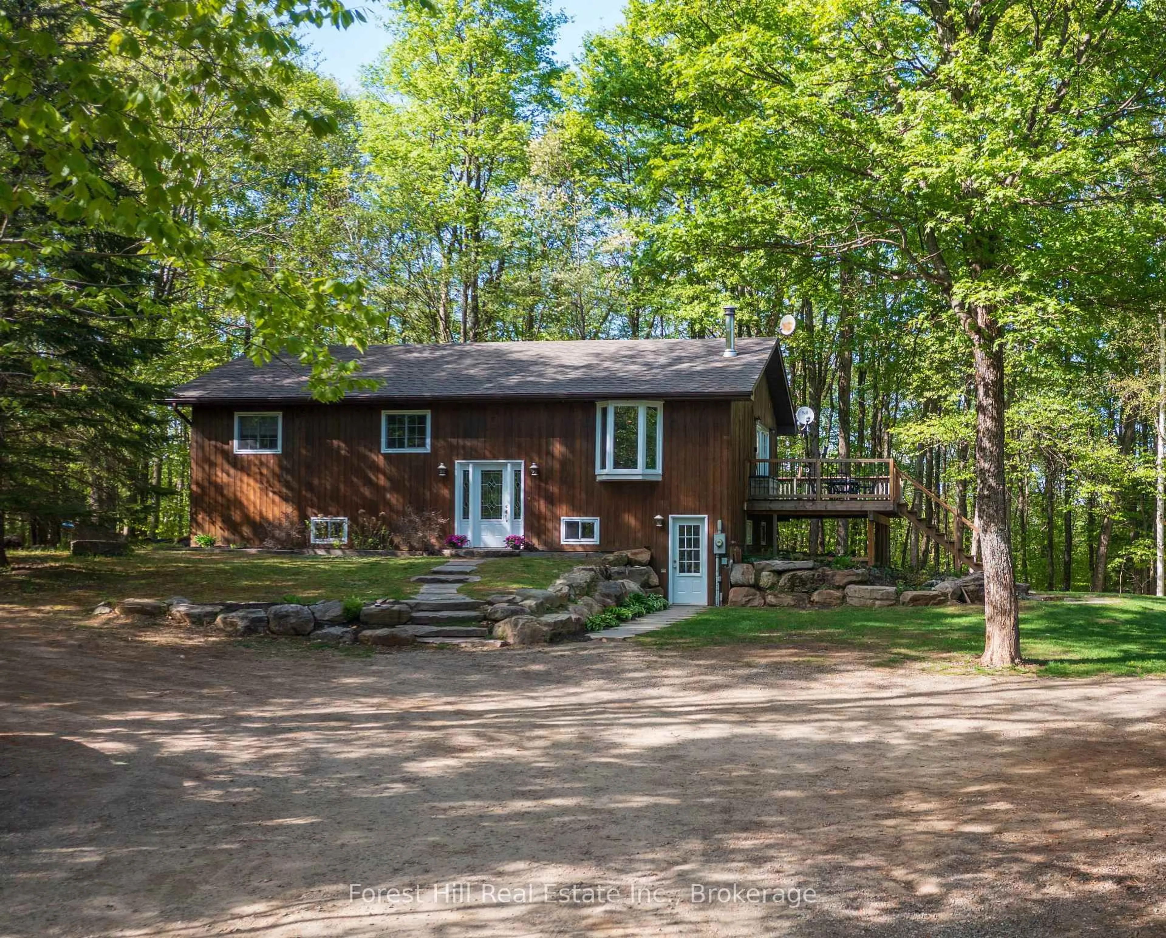 A pic from outside/outdoor area/front of a property/back of a property/a pic from drone, forest/trees view for 917 Portage Rd, Lake of Bays Ontario P1H 2J6
