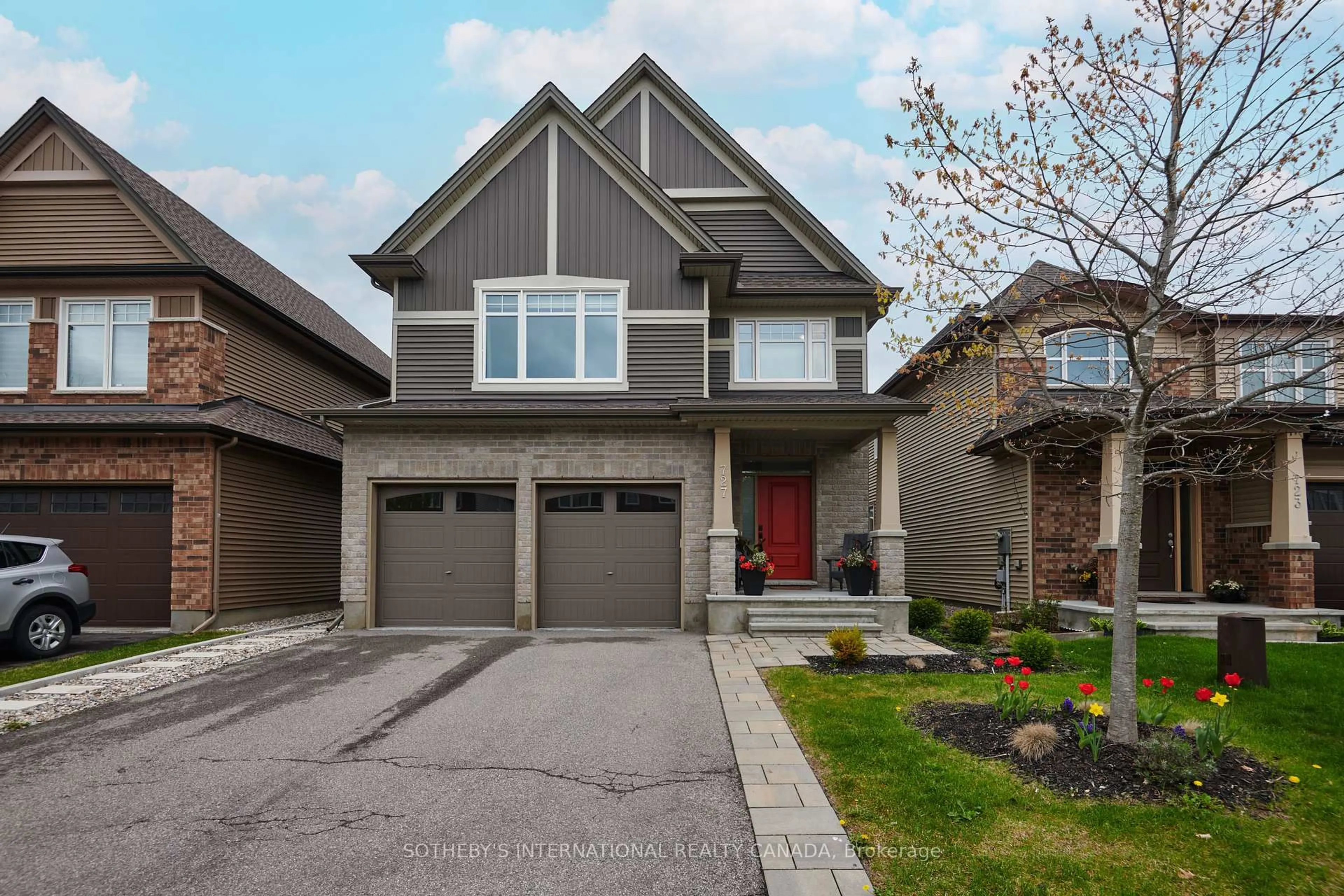 Home with brick exterior material, street for 727 Bunchberry Way N/A, Ottawa Ontario K1T 3T8
