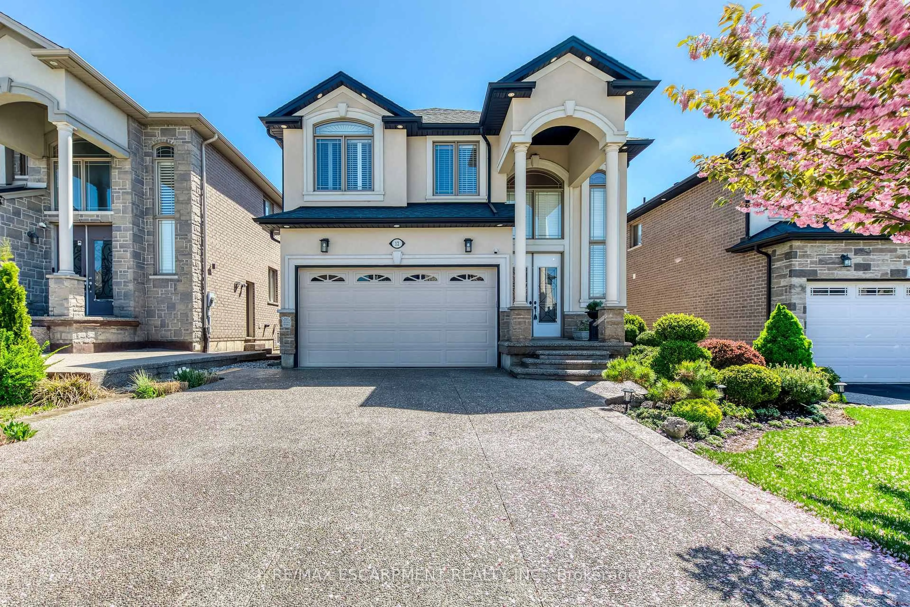Home with brick exterior material, street for 12 Riva Crt, Hamilton Ontario L9B 0H9