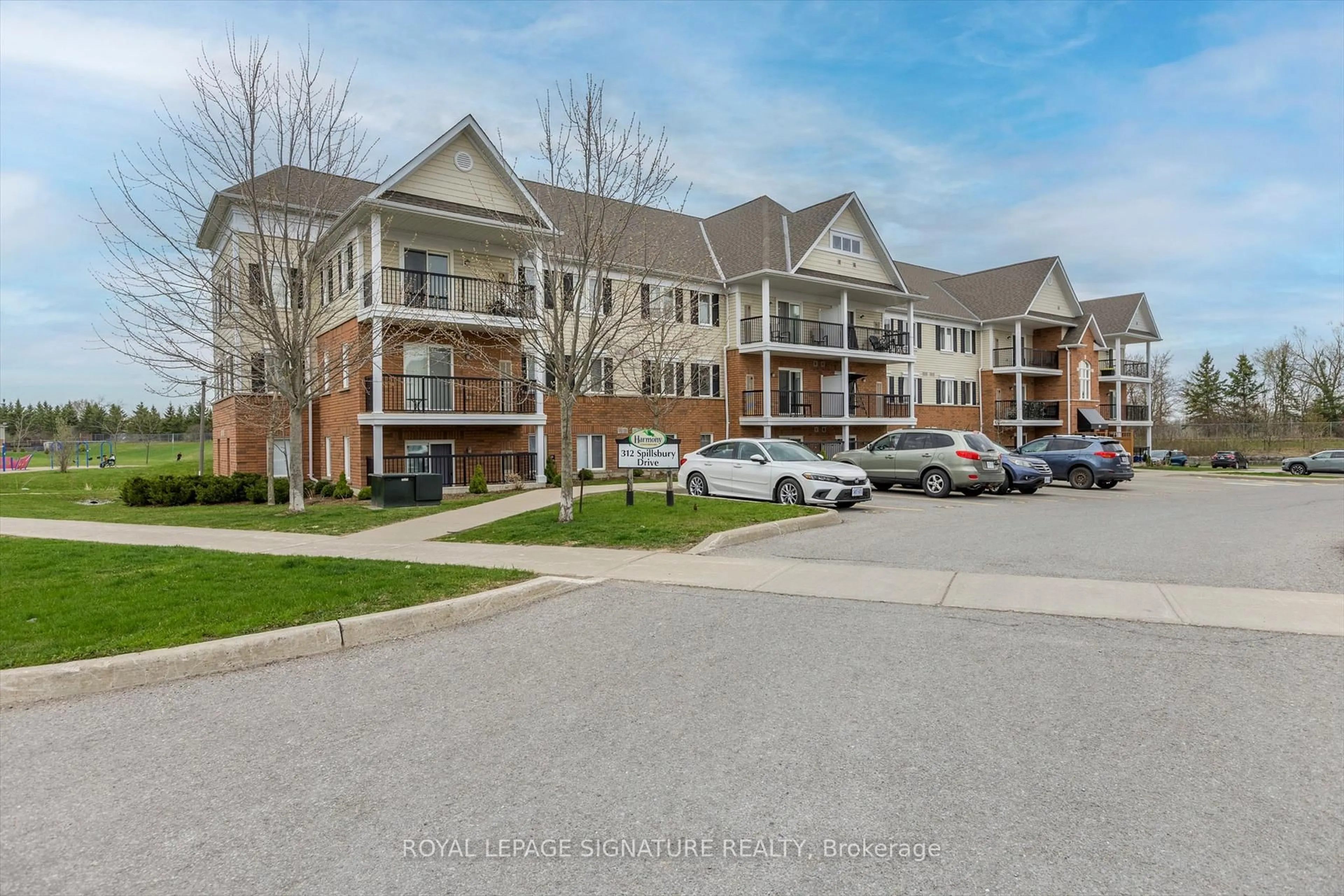 A pic from outside/outdoor area/front of a property/back of a property/a pic from drone, street for 312 Spillsbury Dr #302, Otonabee-South Monaghan Ontario K9K 0B6
