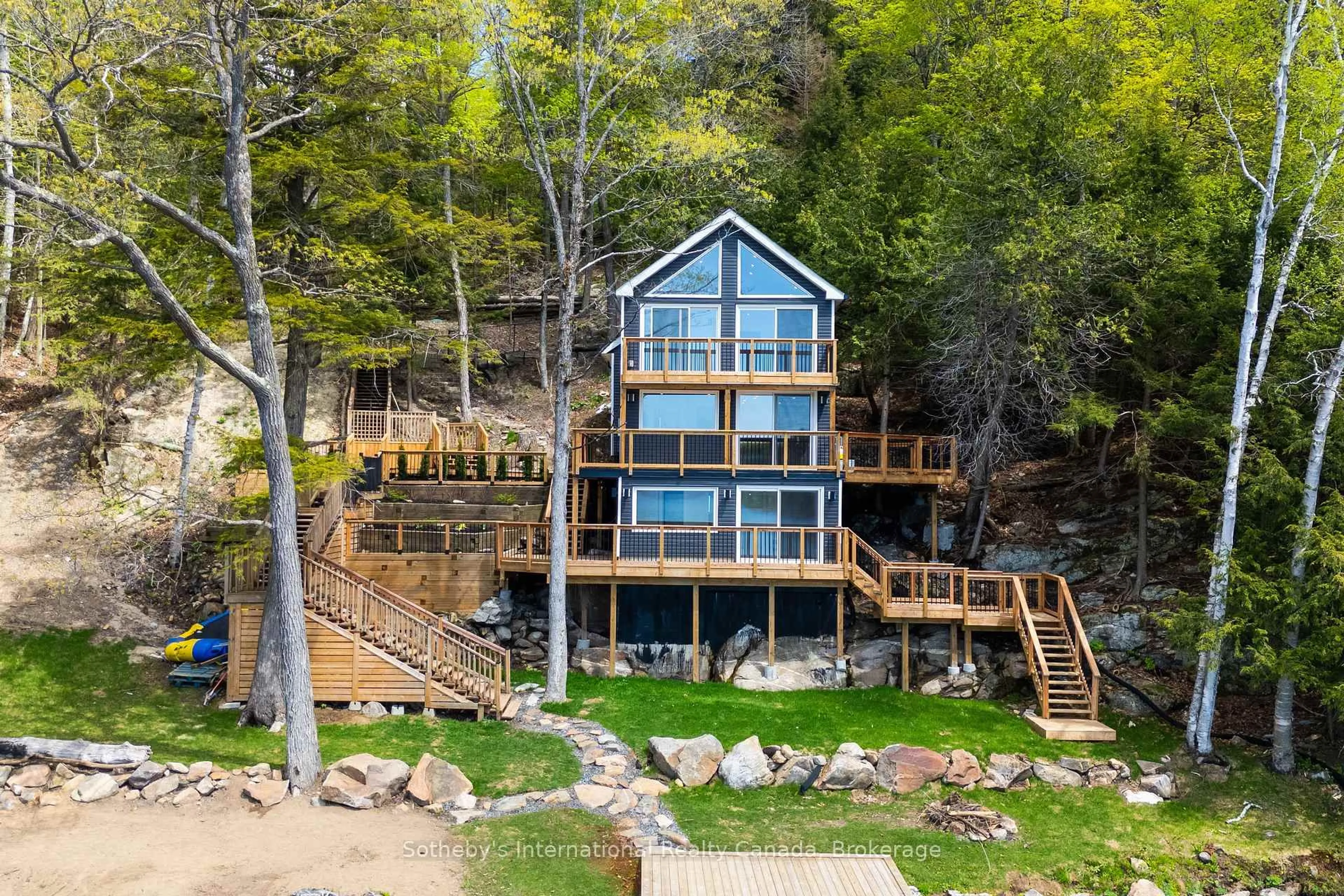 A pic from outside/outdoor area/front of a property/back of a property/a pic from drone, water/lake/river/ocean view for 62 Mill Lake Tr, McDougall Ontario P2A 2W9
