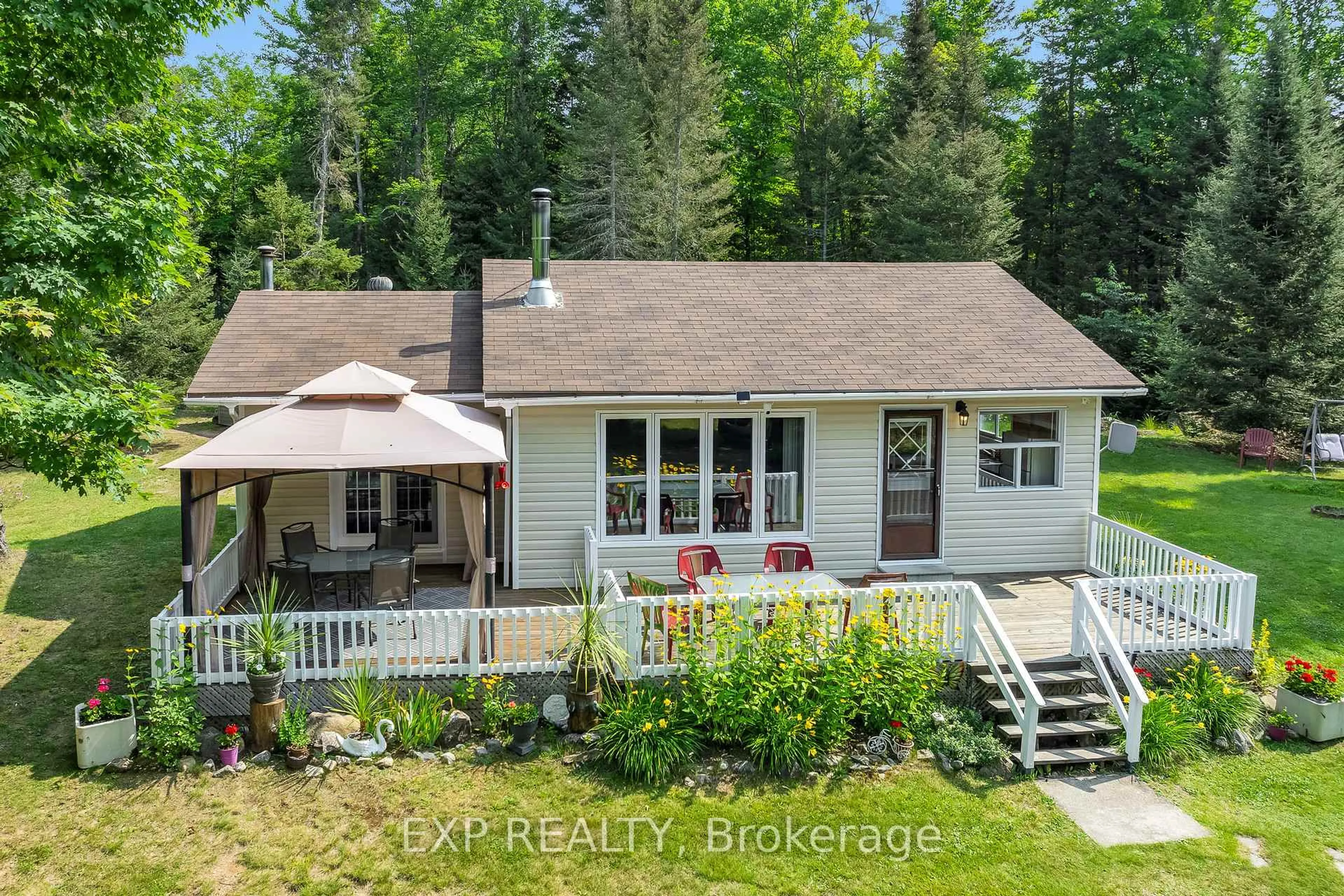 A pic from outside/outdoor area/front of a property/back of a property/a pic from drone, water/lake/river/ocean view for 2288 Eagle Lake Rd, Machar Ontario P0A 1X0