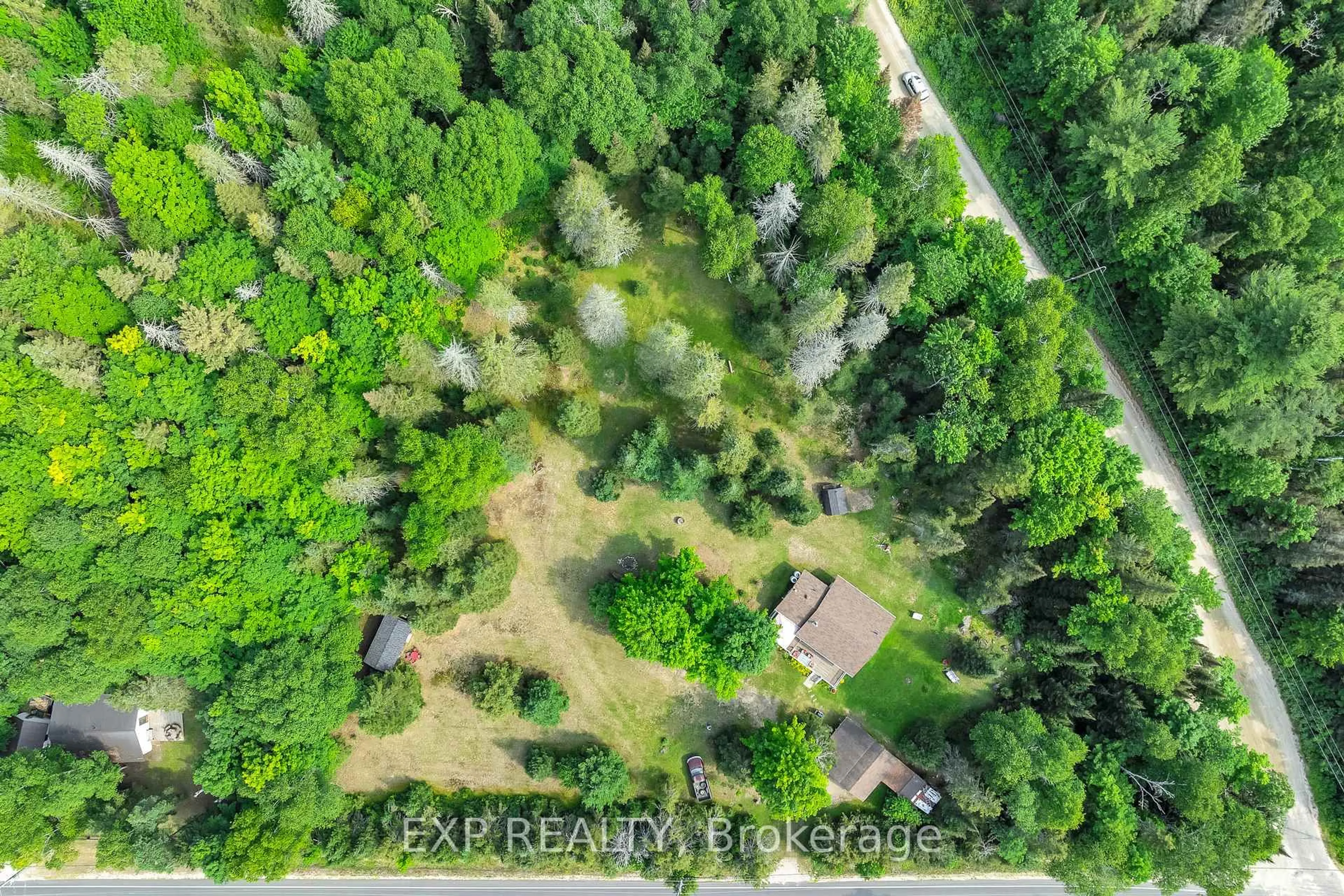 A pic from outside/outdoor area/front of a property/back of a property/a pic from drone, forest/trees view for 2288 Eagle Lake Rd, Machar Ontario P0A 1X0