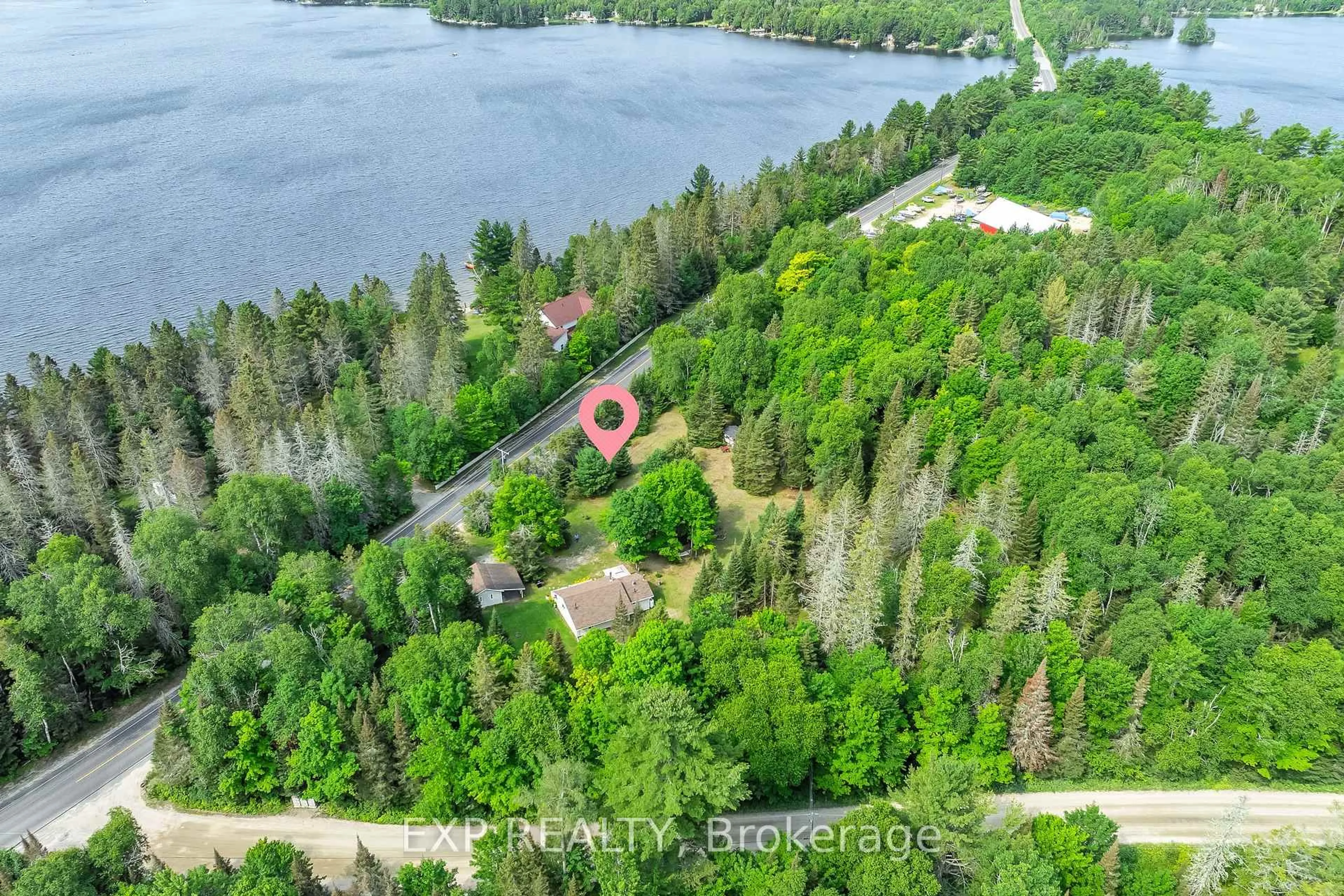 A pic from outside/outdoor area/front of a property/back of a property/a pic from drone, water/lake/river/ocean view for 2288 Eagle Lake Rd, Machar Ontario P0A 1X0