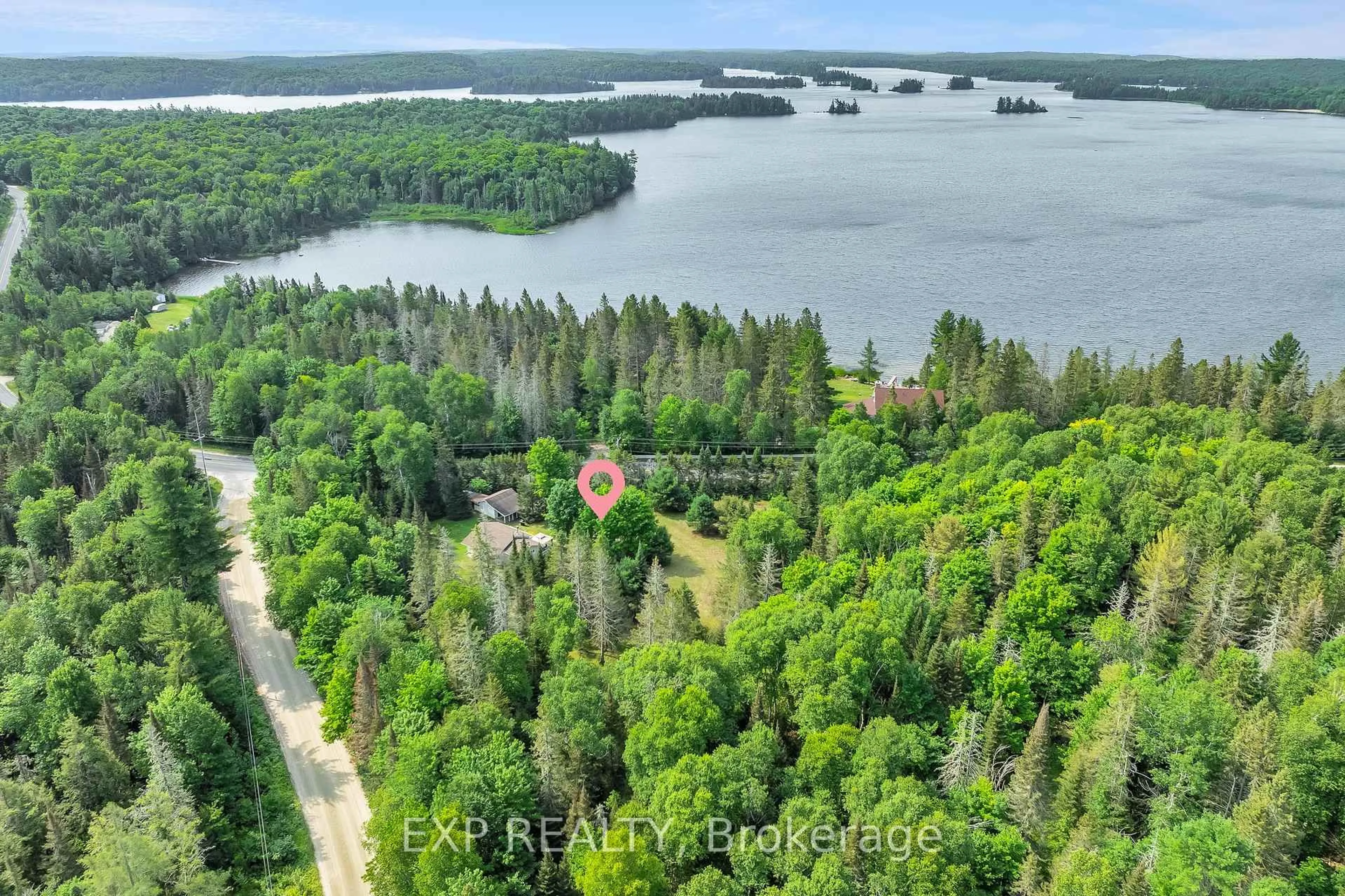 A pic from outside/outdoor area/front of a property/back of a property/a pic from drone, water/lake/river/ocean view for 2288 Eagle Lake Rd, Machar Ontario P0A 1X0