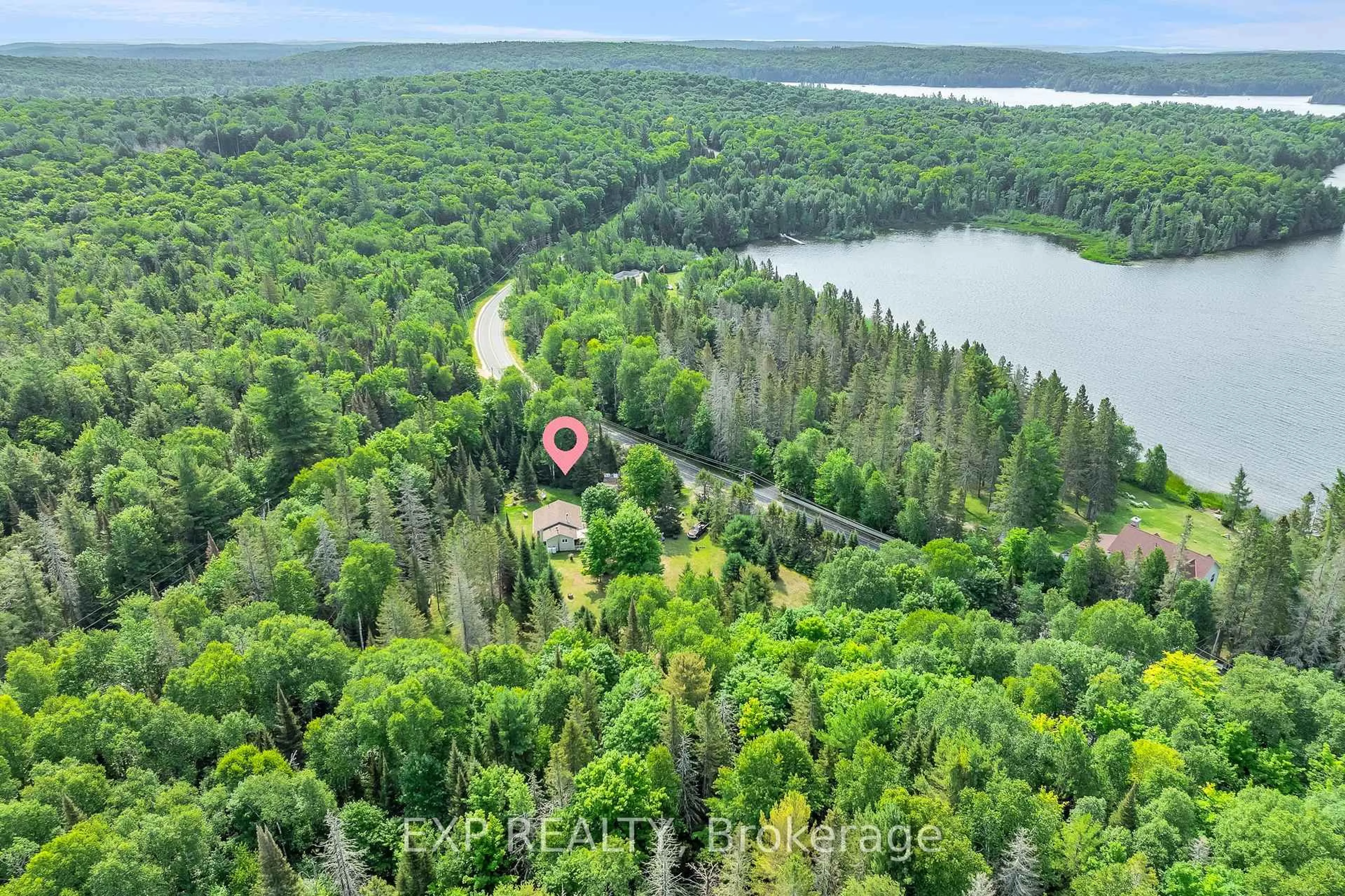 A pic from outside/outdoor area/front of a property/back of a property/a pic from drone, forest/trees view for 2288 Eagle Lake Rd, Machar Ontario P0A 1X0