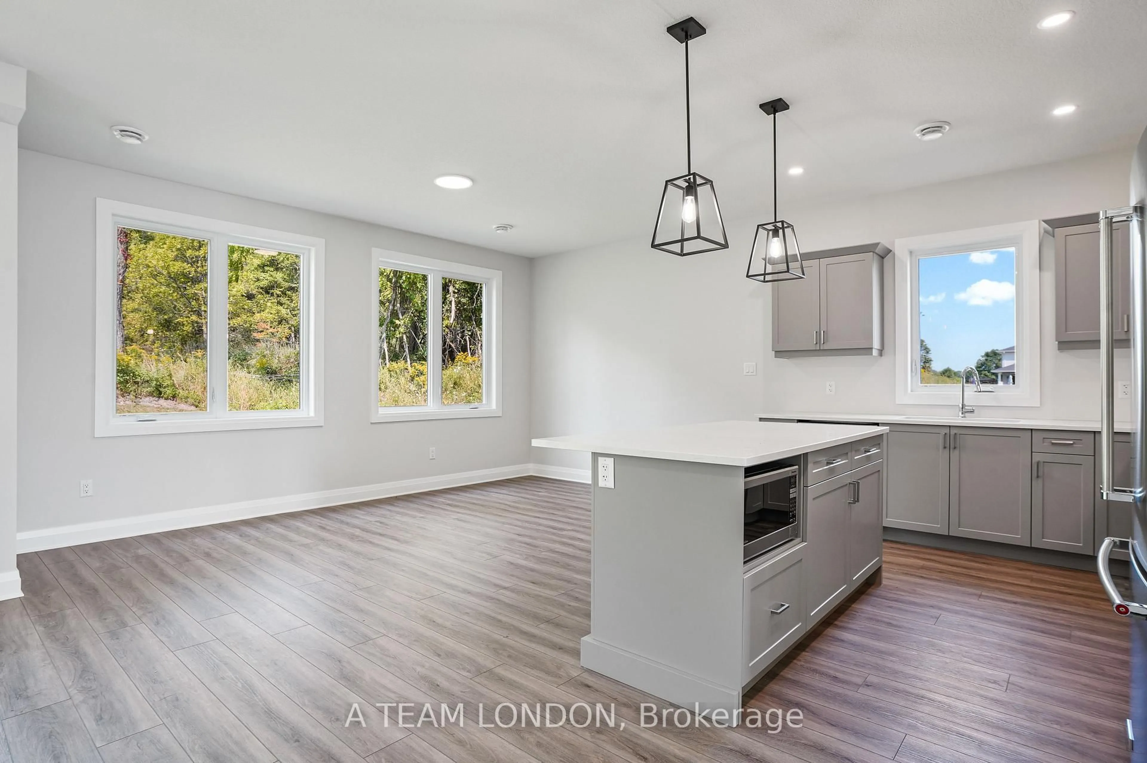 Open concept kitchen, wood/laminate floor for 72 The Promenade, Central Elgin Ontario N5L 1C5