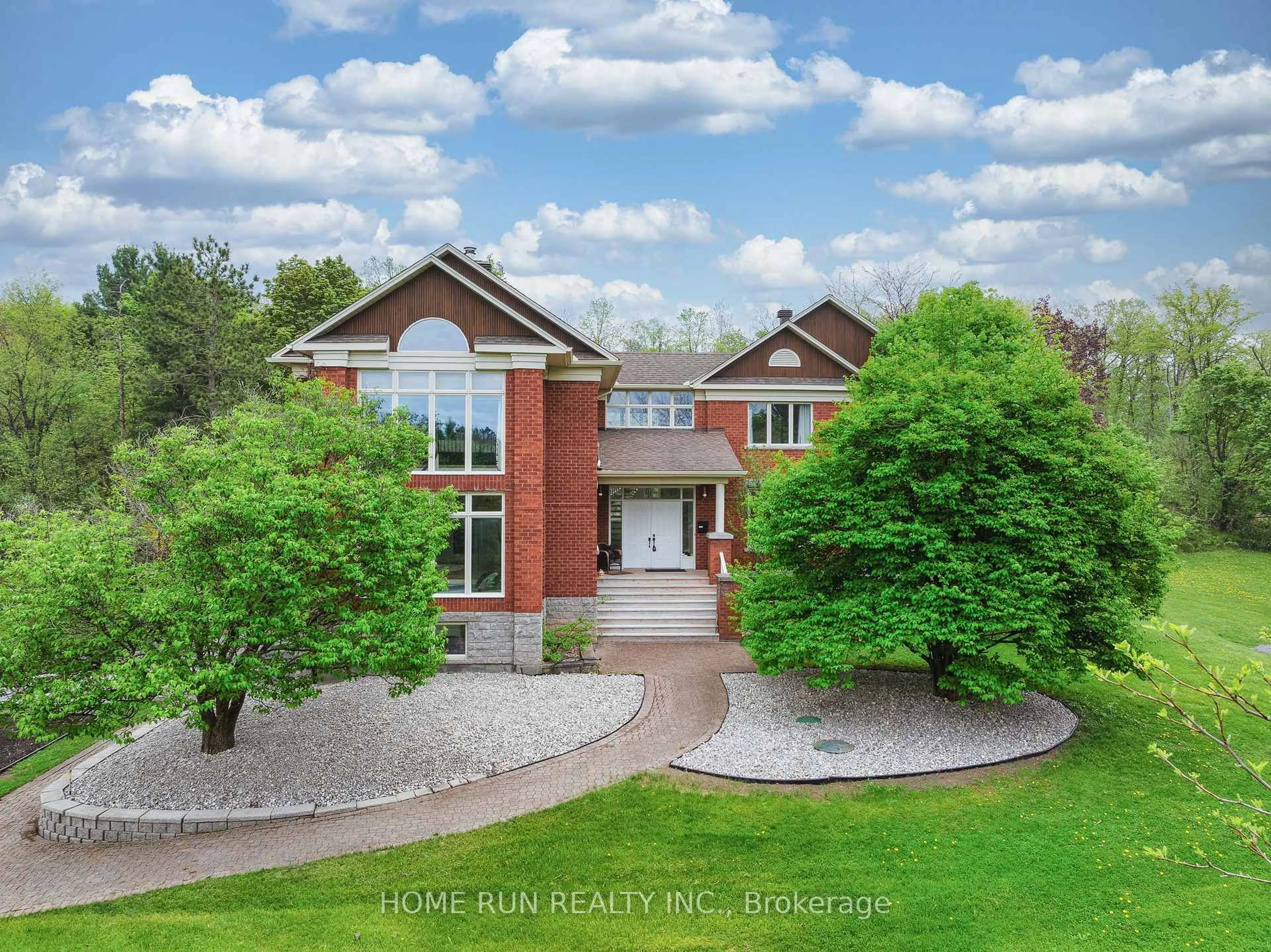 A pic from outside/outdoor area/front of a property/back of a property/a pic from drone, unknown for 112 Lochcarron Cres, Carp Ontario K0A 1L0