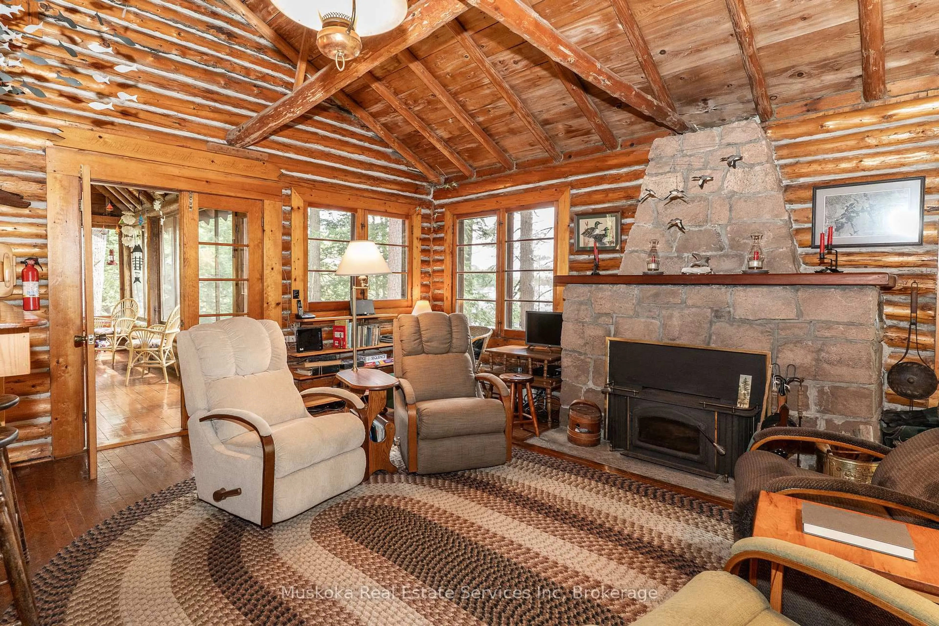Living room with furniture, wood/laminate floor for 620 Kahshe Lake, Gravenhurst Ontario P0E 1G0