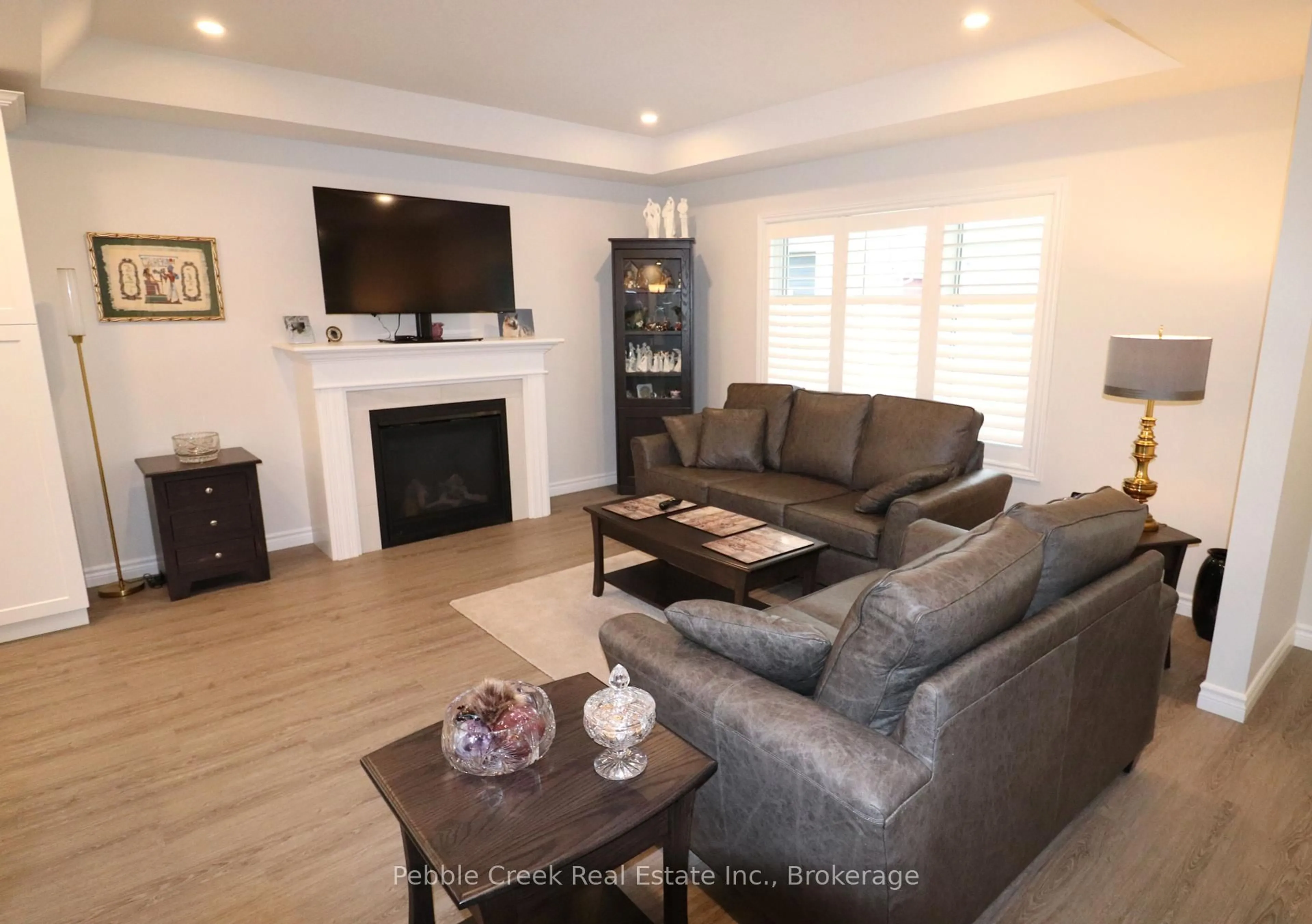 Living room with furniture, wood/laminate floor for 112 Huron Heights Dr, Ashfield-Colborne-Wawanosh Ontario N7A 0C1