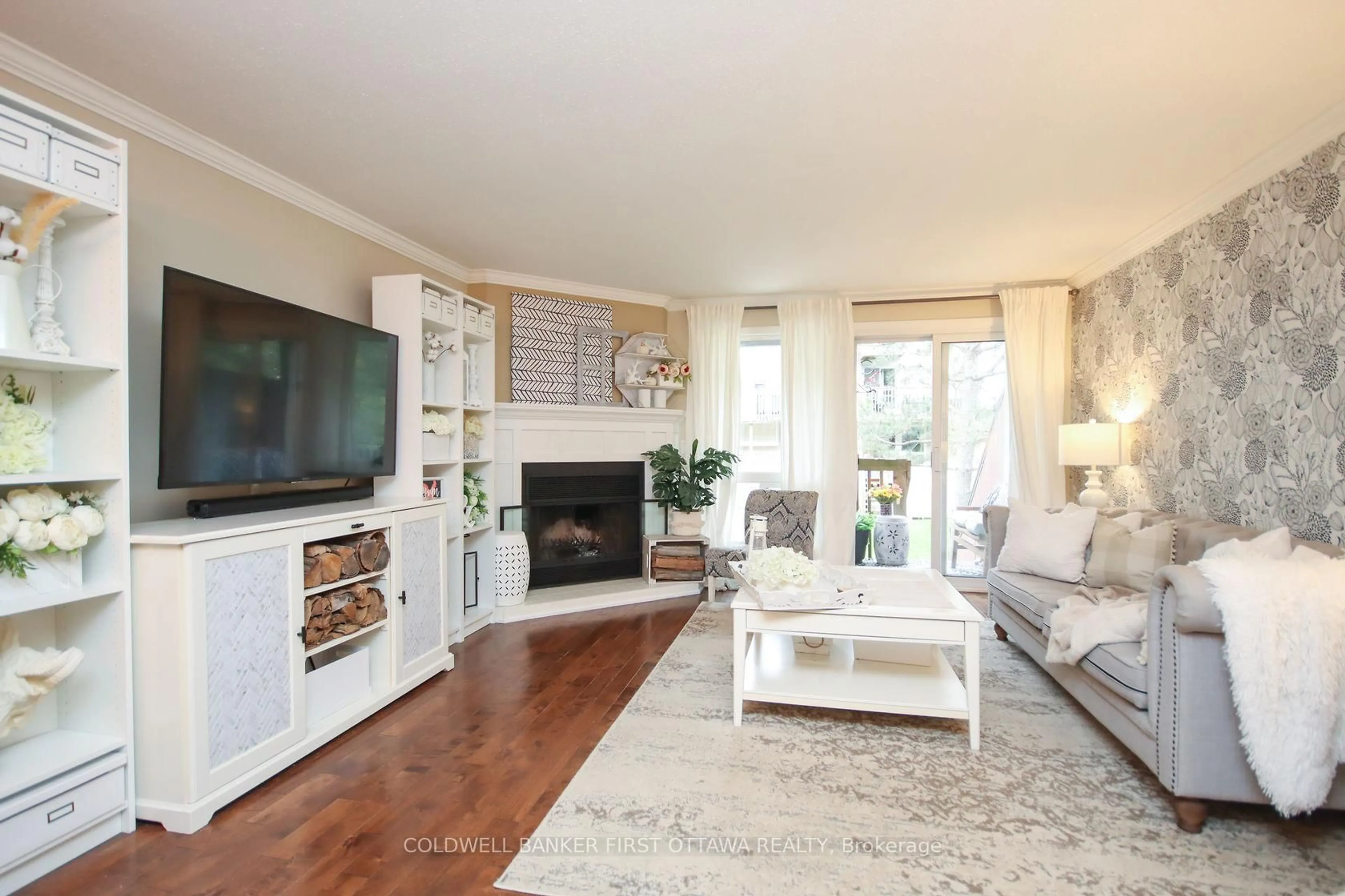 Living room with furniture, wood/laminate floor for 6702 Jeanne Darc Blvd #A, Ottawa Ontario K1C 6E9