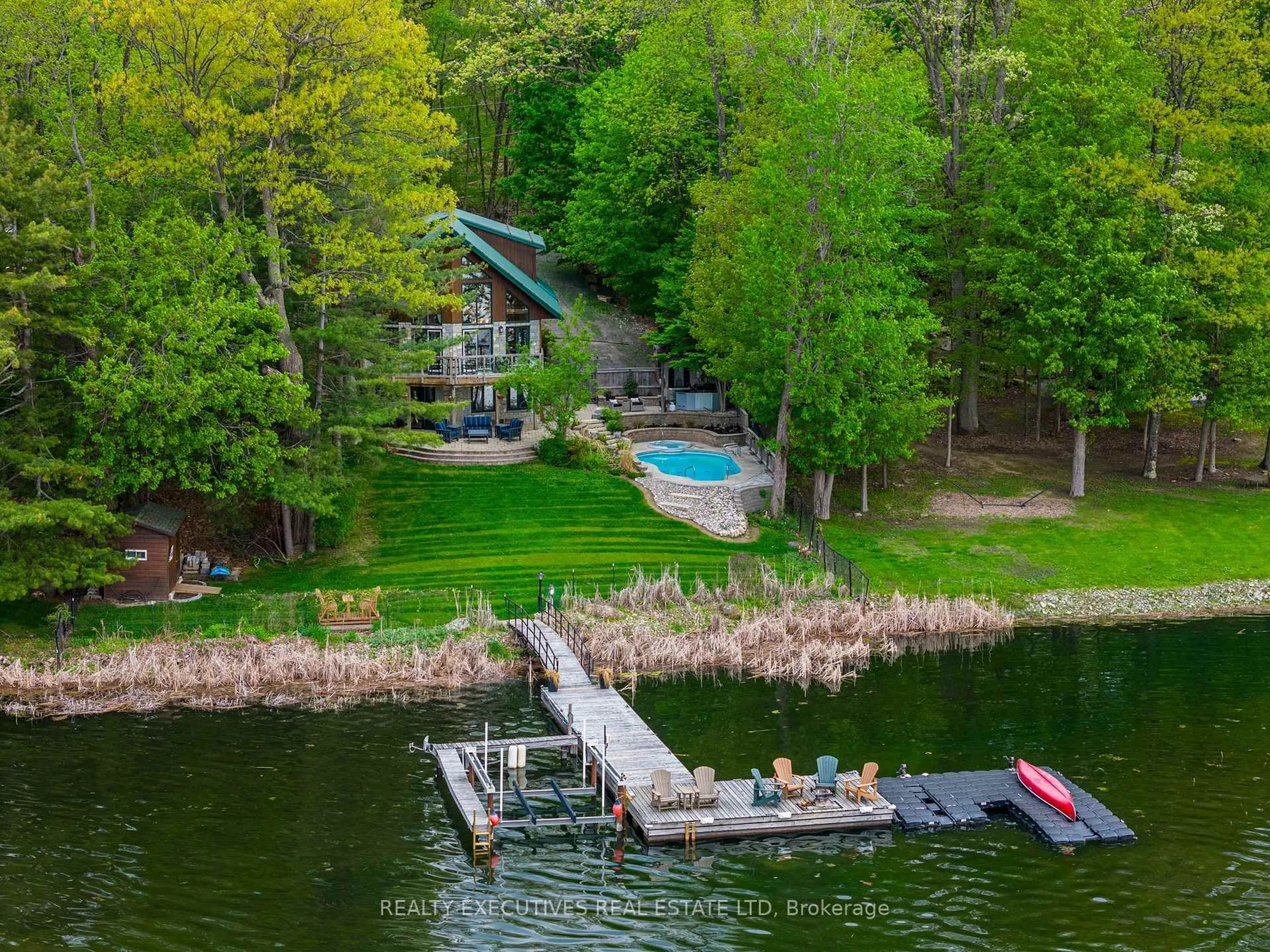 A pic from outside/outdoor area/front of a property/back of a property/a pic from drone, water/lake/river/ocean view for 106 Black Snake Lane, Lansdowne Ontario K0E 1L0