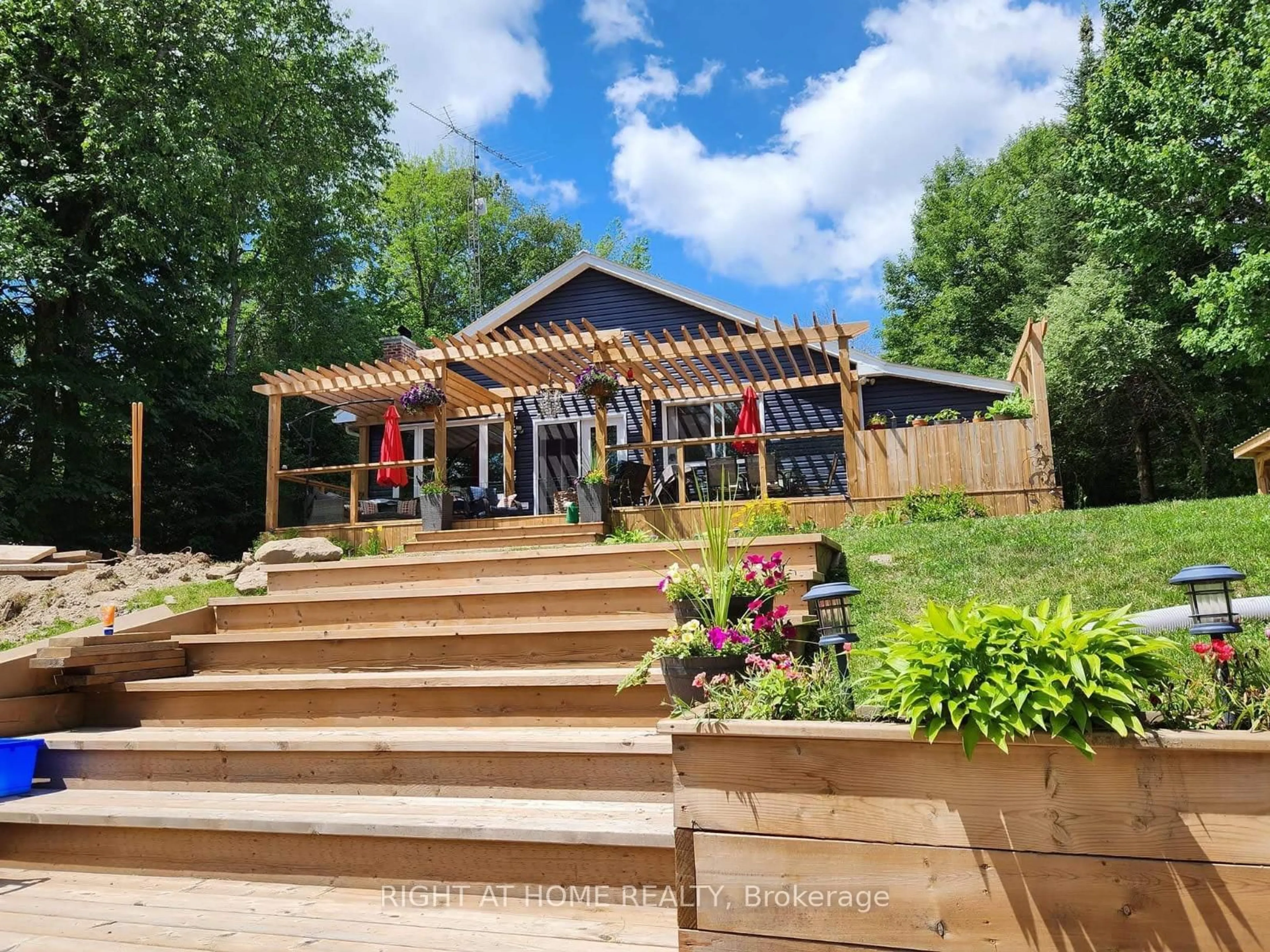 A pic from outside/outdoor area/front of a property/back of a property/a pic from drone, unknown for 54 Riverbank Rd, Kawartha Lakes Ontario K0M 1N0