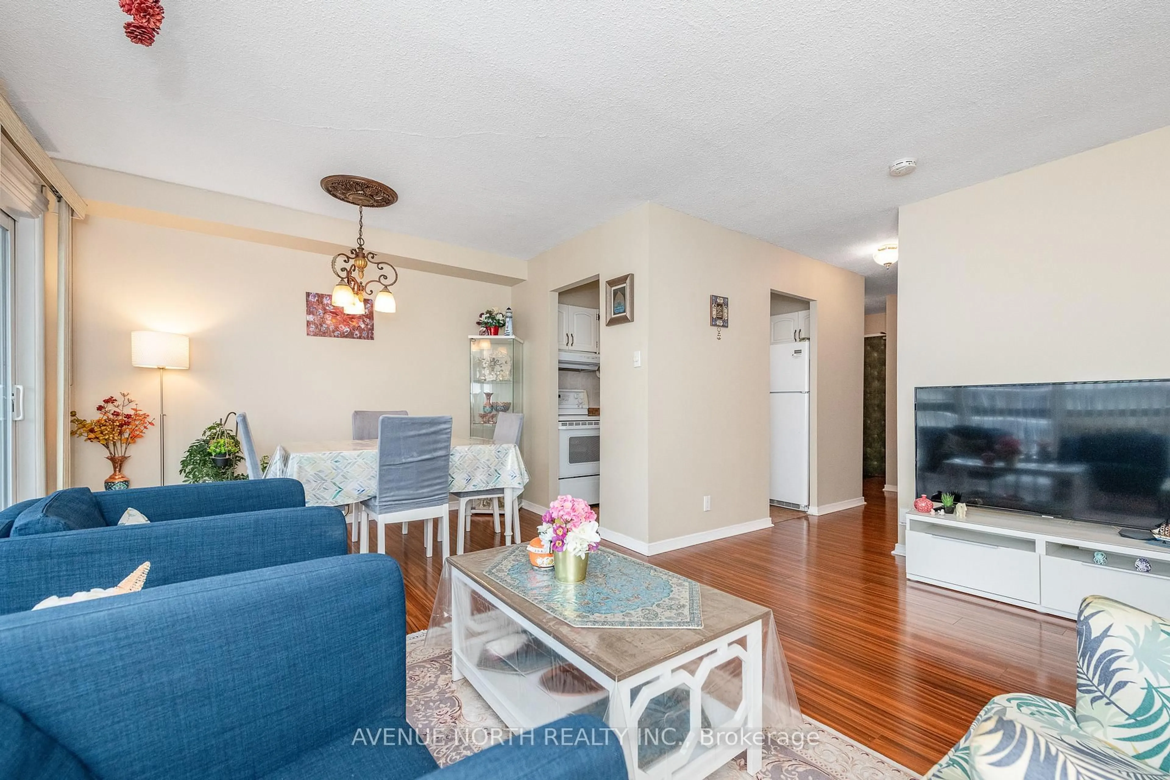 Living room with furniture, wood/laminate floor for 158A Mcarthur Ave #1504, Ottawa Ontario K1L 7E7