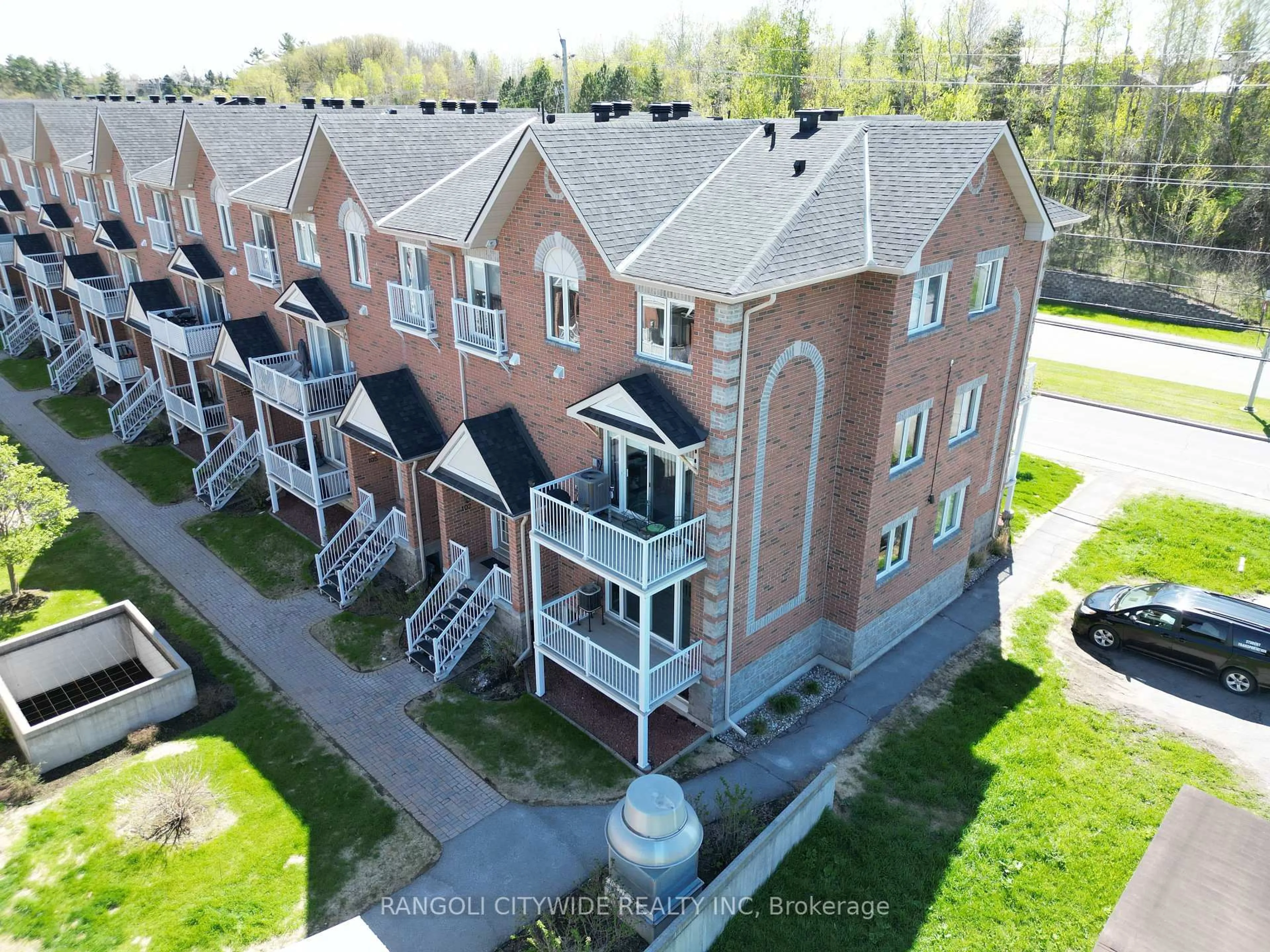 A pic from outside/outdoor area/front of a property/back of a property/a pic from drone, unknown for 3265 St Joseph Blvd #101, Ottawa Ontario K1E 3Y2