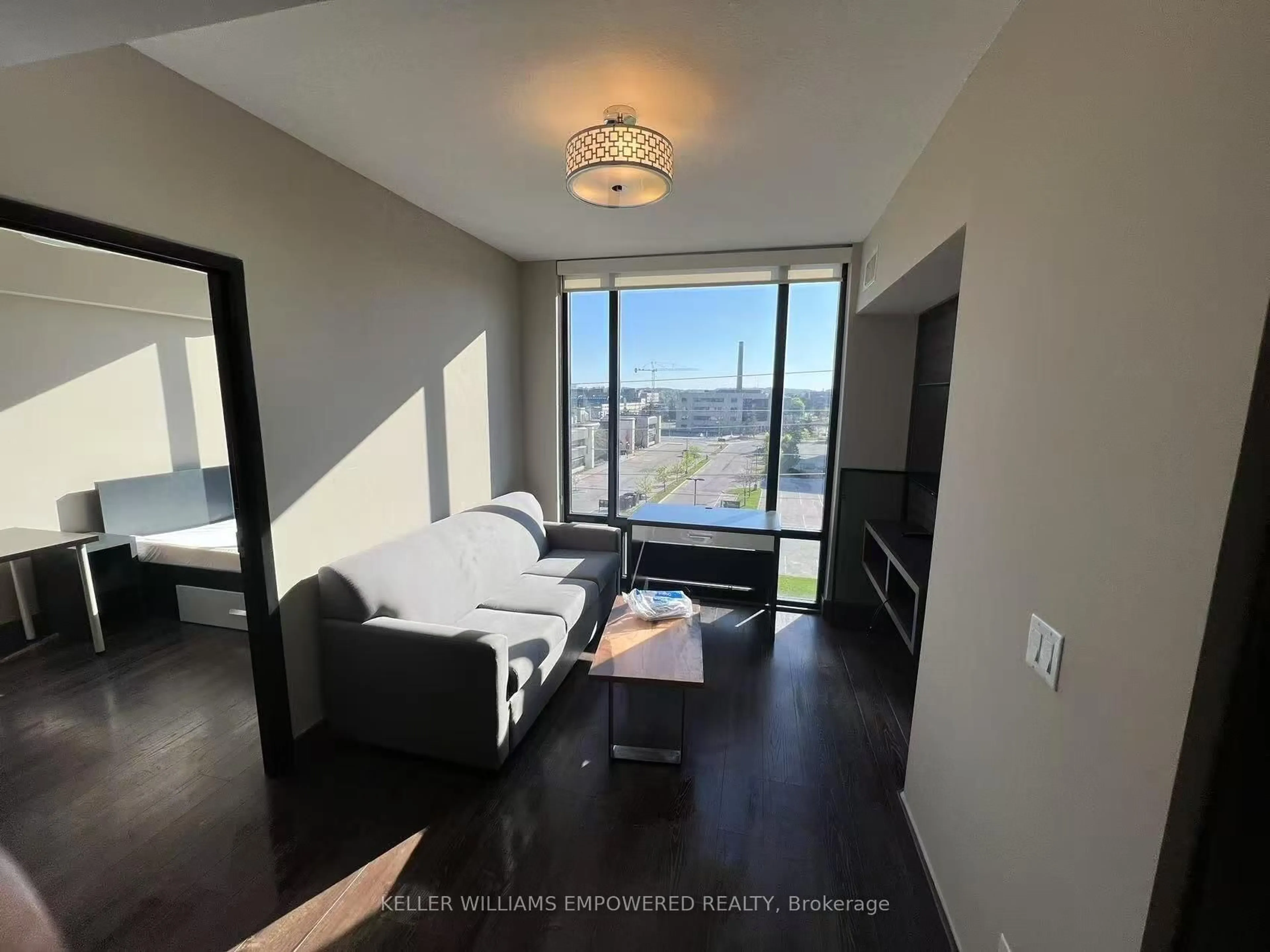 Living room with furniture, wood/laminate floor for 330 Phillip St #C637, Waterloo Ontario N2L 3W9