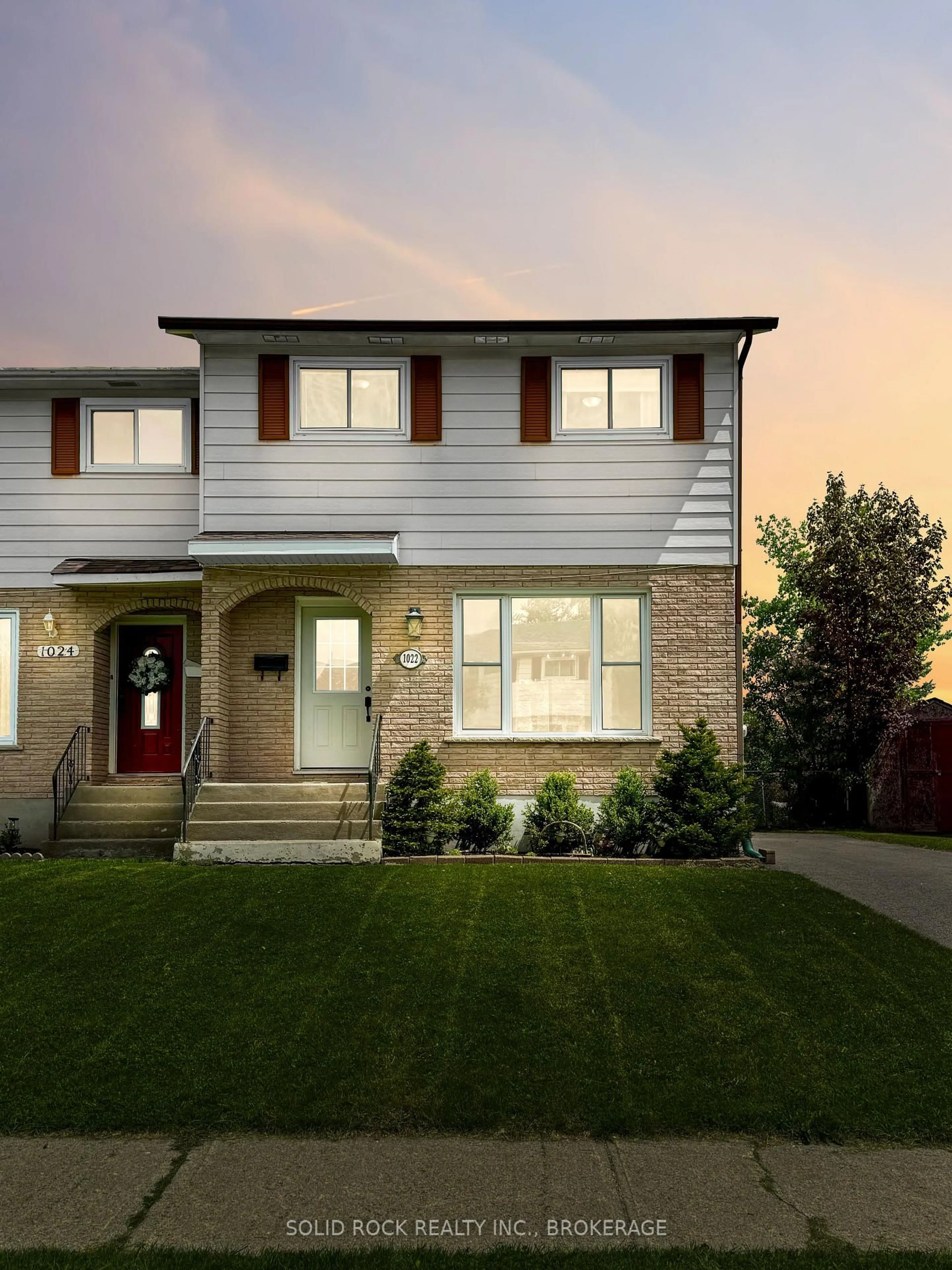 Home with vinyl exterior material, street for 1022 Sprucewood Cres, Kingston Ontario K7P 1N1