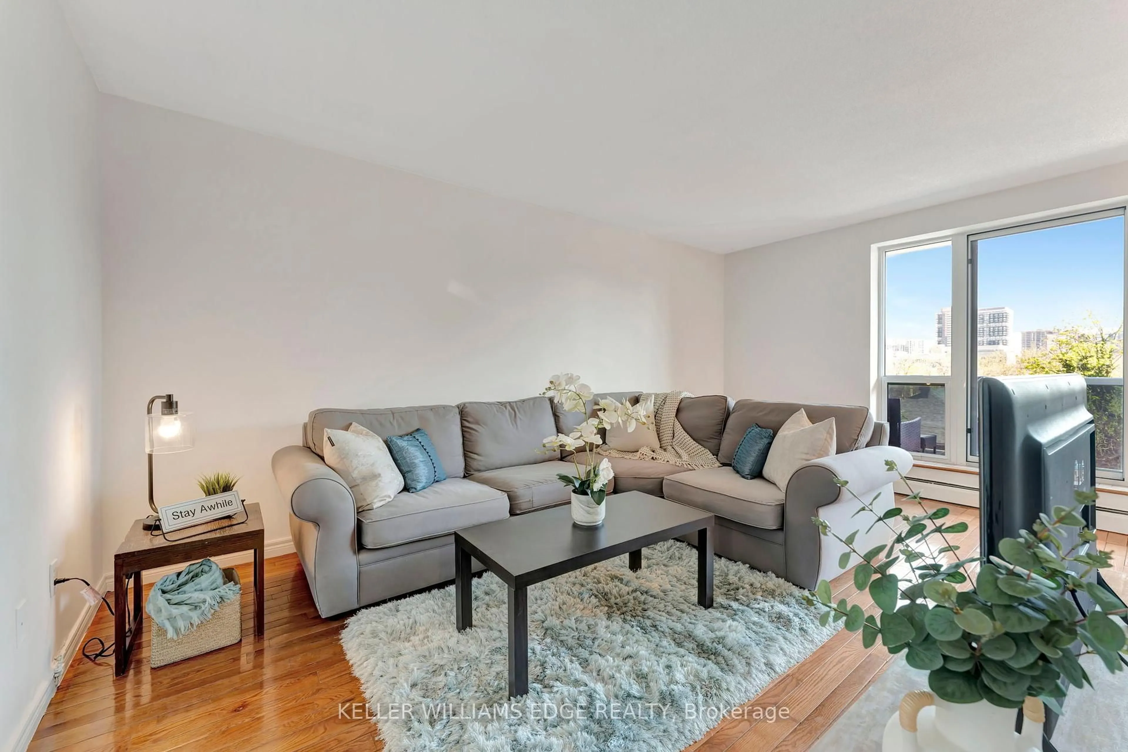 Living room with furniture, wood/laminate floor for 81 CHARLTON Ave #201, Hamilton Ontario L8N 1Y7