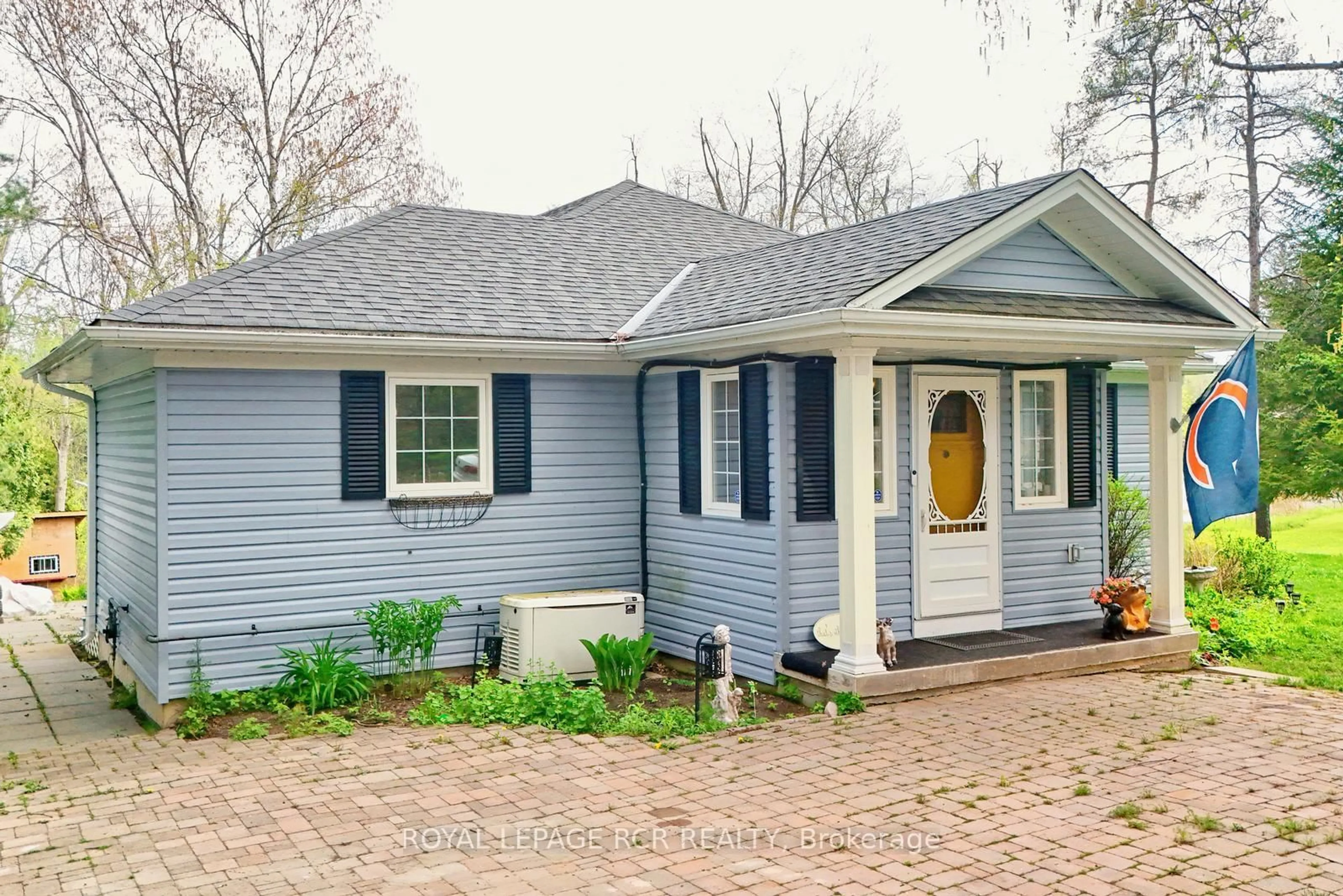 Home with vinyl exterior material, street for 24 Dean Rd, Mulmur Ontario L0N 1S8