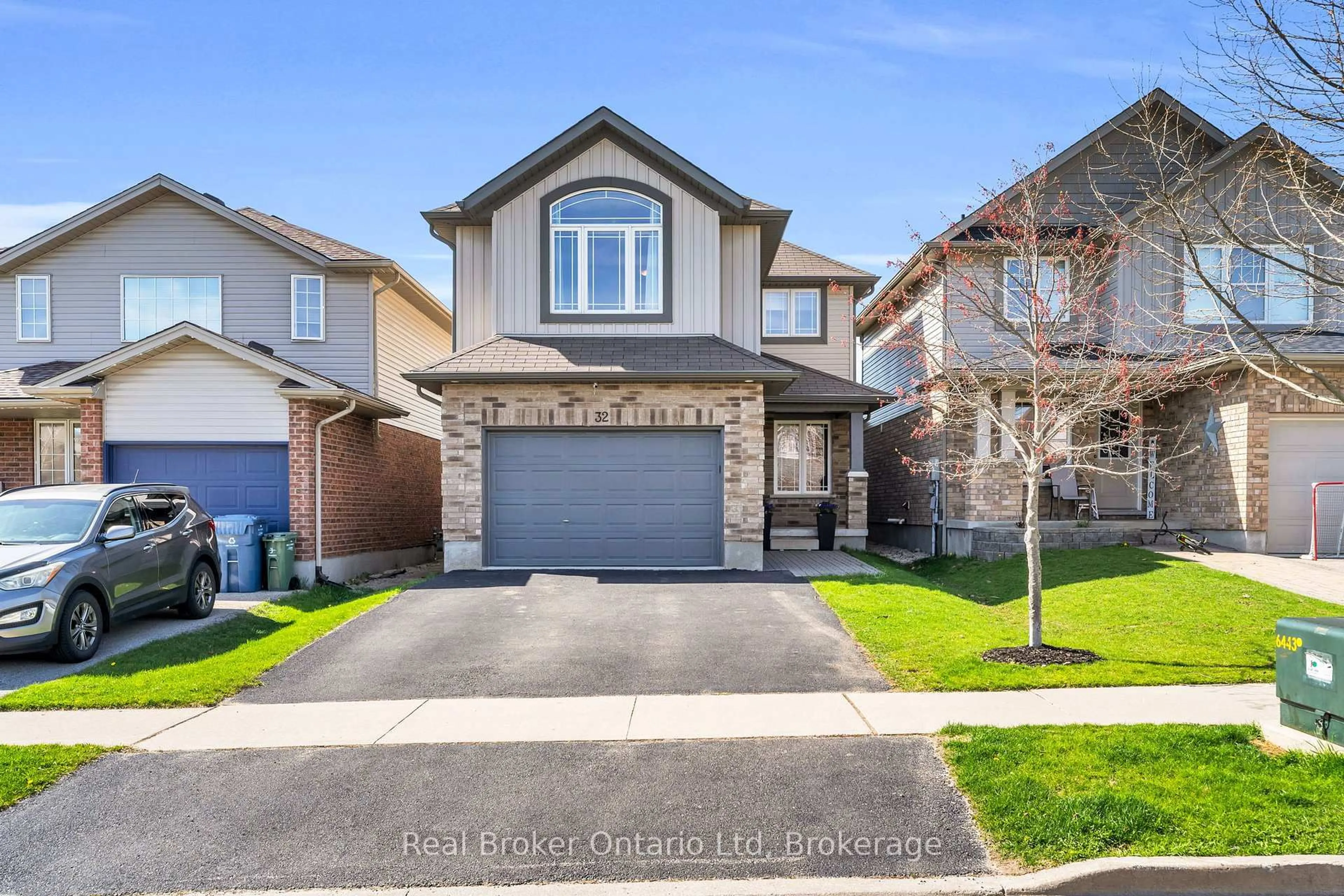 Home with brick exterior material, street for 32 Maude Lane, Guelph Ontario N1E 0G3