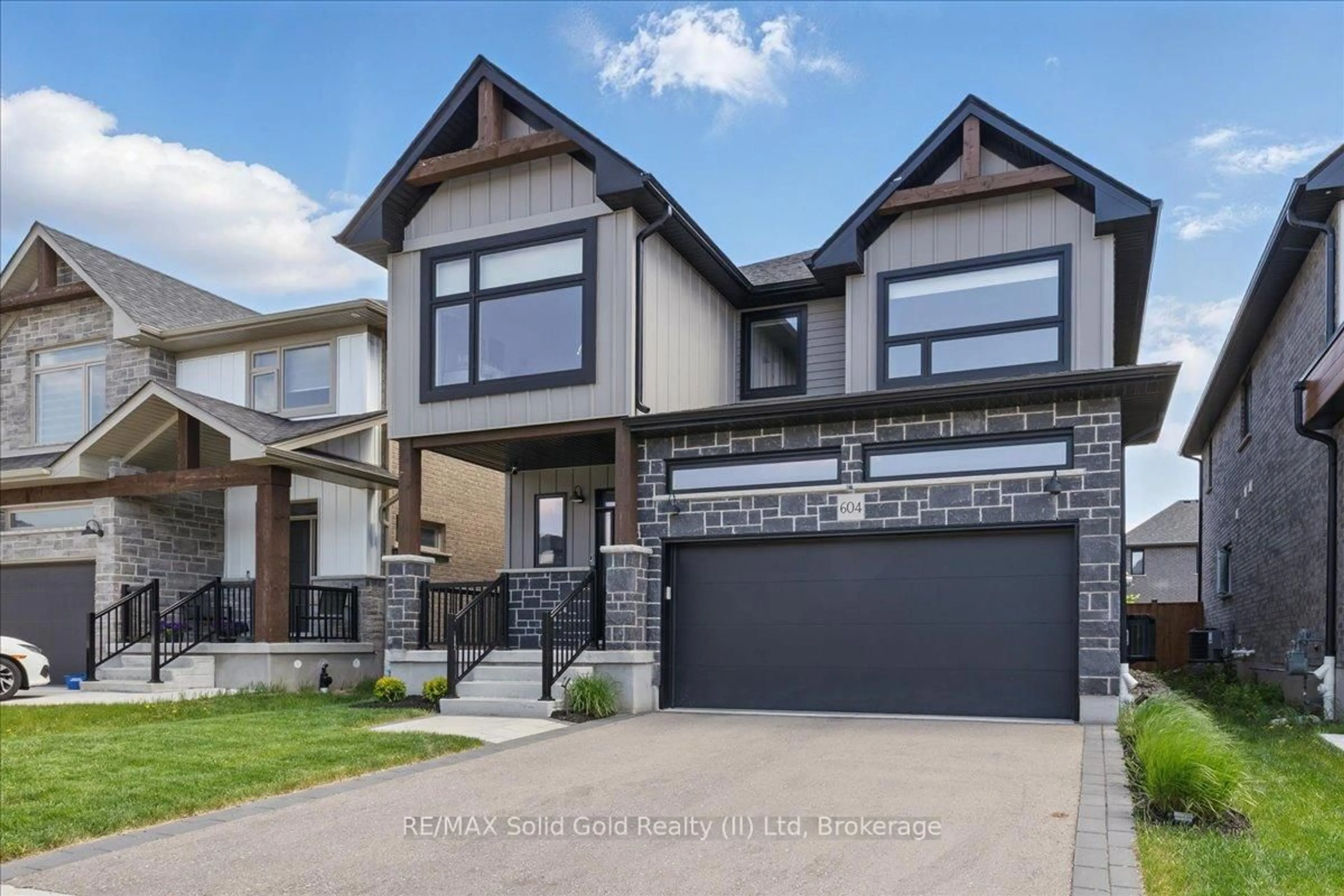 Home with brick exterior material, street for 604 Doonwoods Cres, Kitchener Ontario N2P 0E6