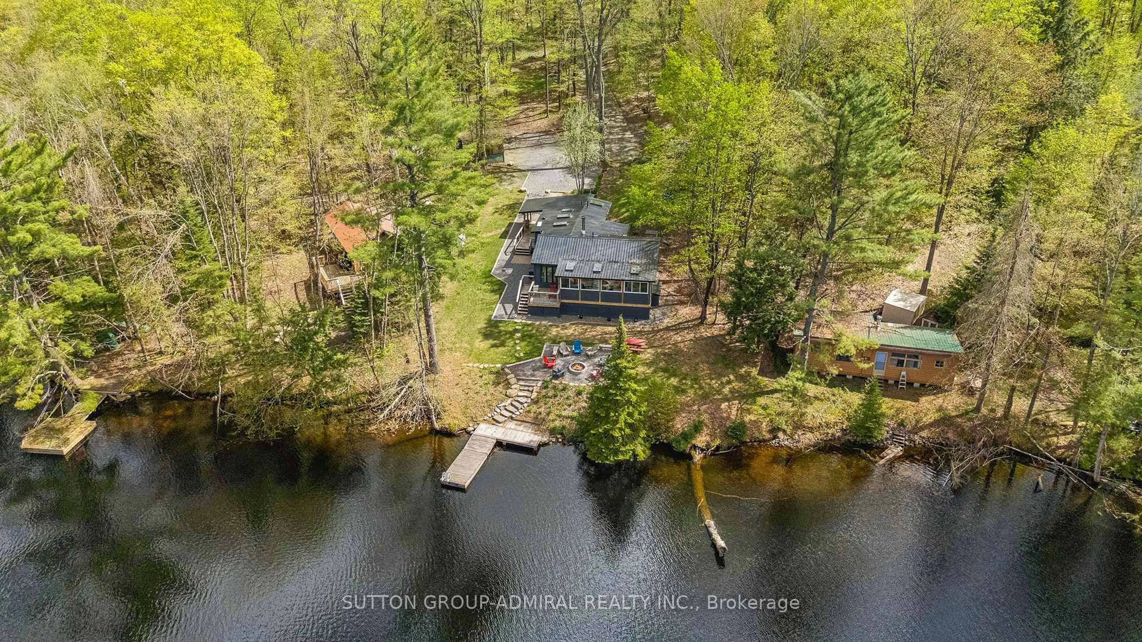 A pic from outside/outdoor area/front of a property/back of a property/a pic from drone, water/lake/river/ocean view for 1023 Kirkpatrick Lane, Bracebridge Ontario P1L 1X1