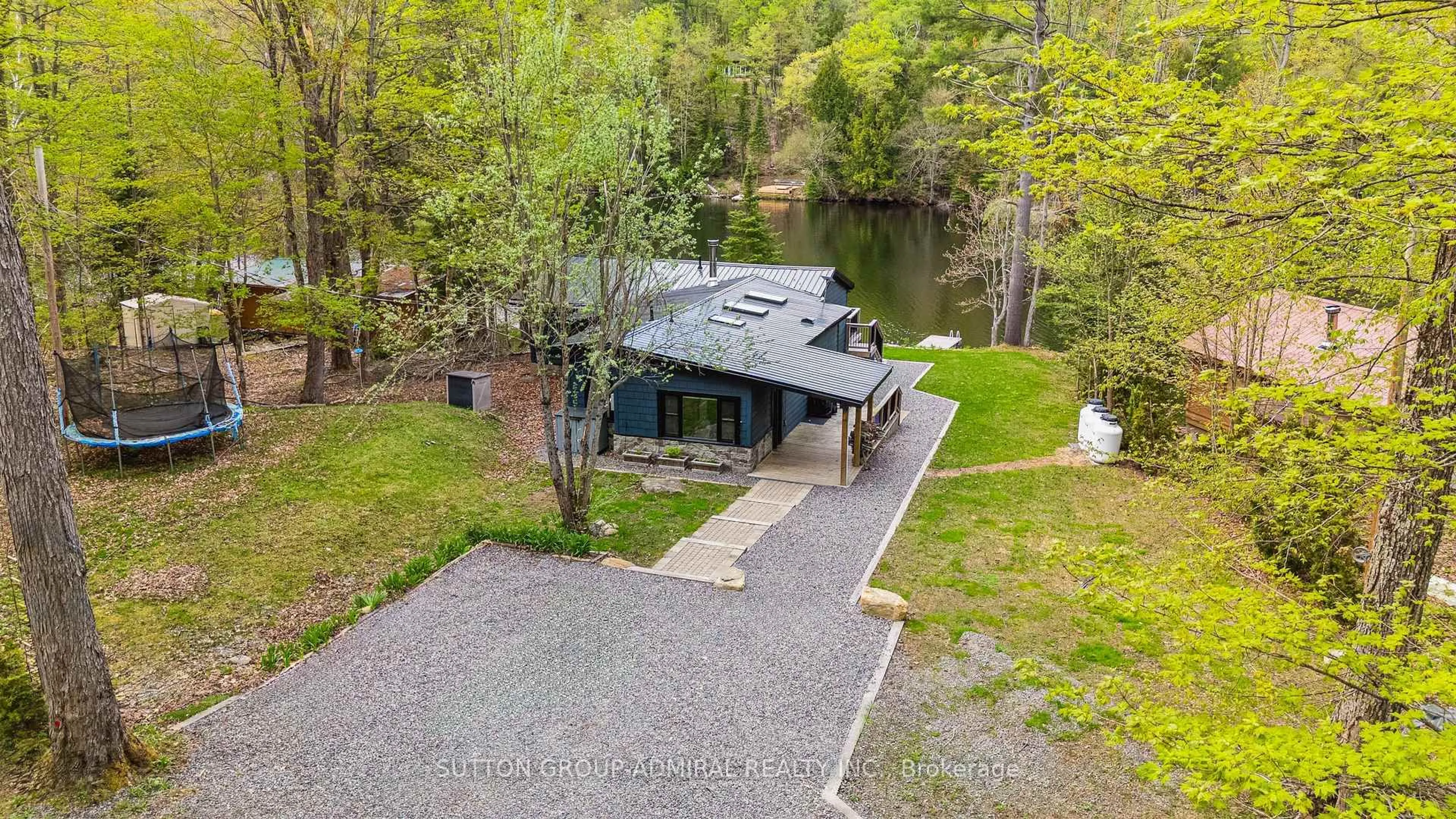 A pic from outside/outdoor area/front of a property/back of a property/a pic from drone, water/lake/river/ocean view for 1023 Kirkpatrick Lane, Bracebridge Ontario P1L 1X1