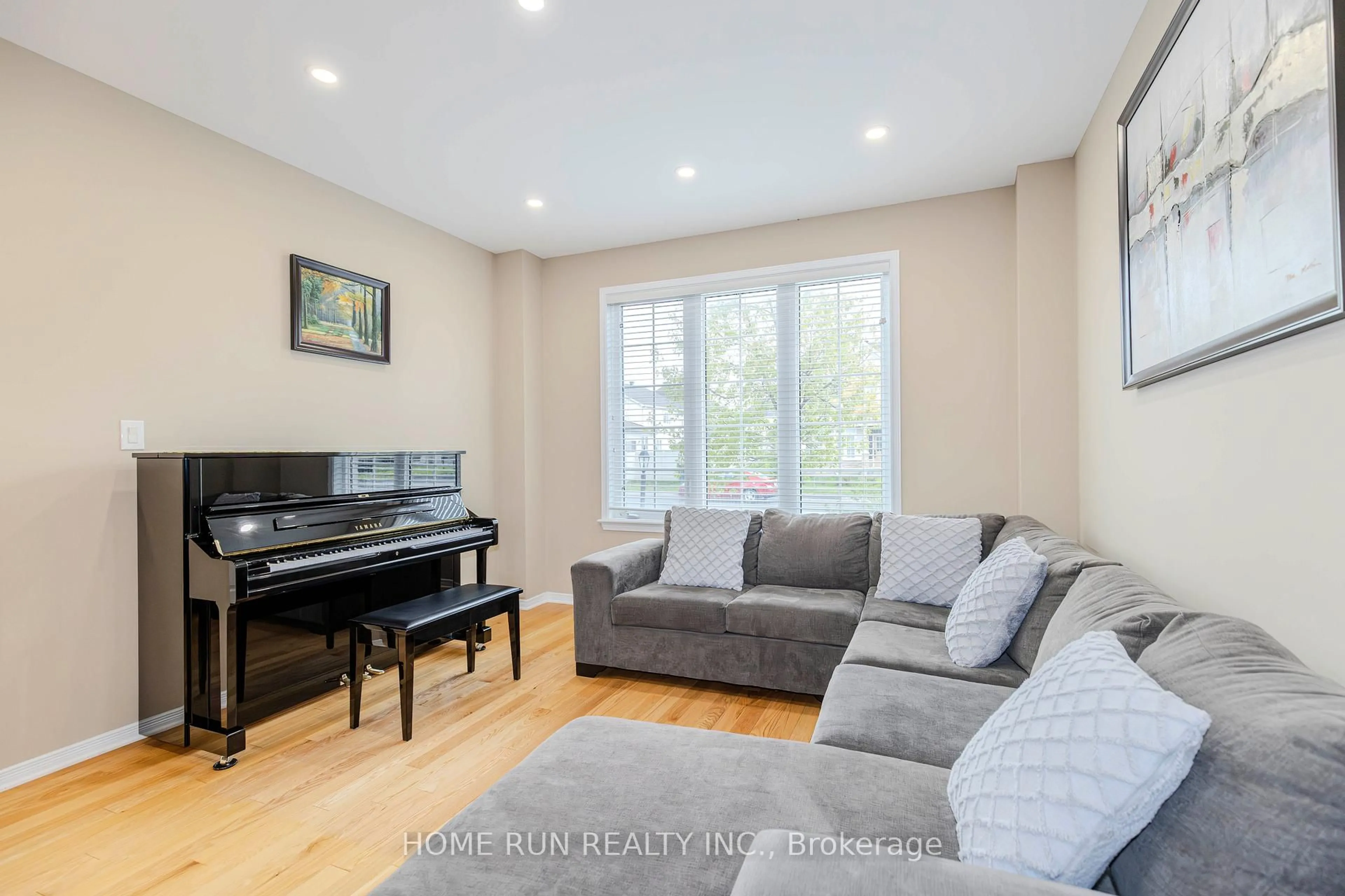 Living room with furniture, wood/laminate floor for 828 Kilbirnie Dr, Ottawa Ontario K2J 5T9