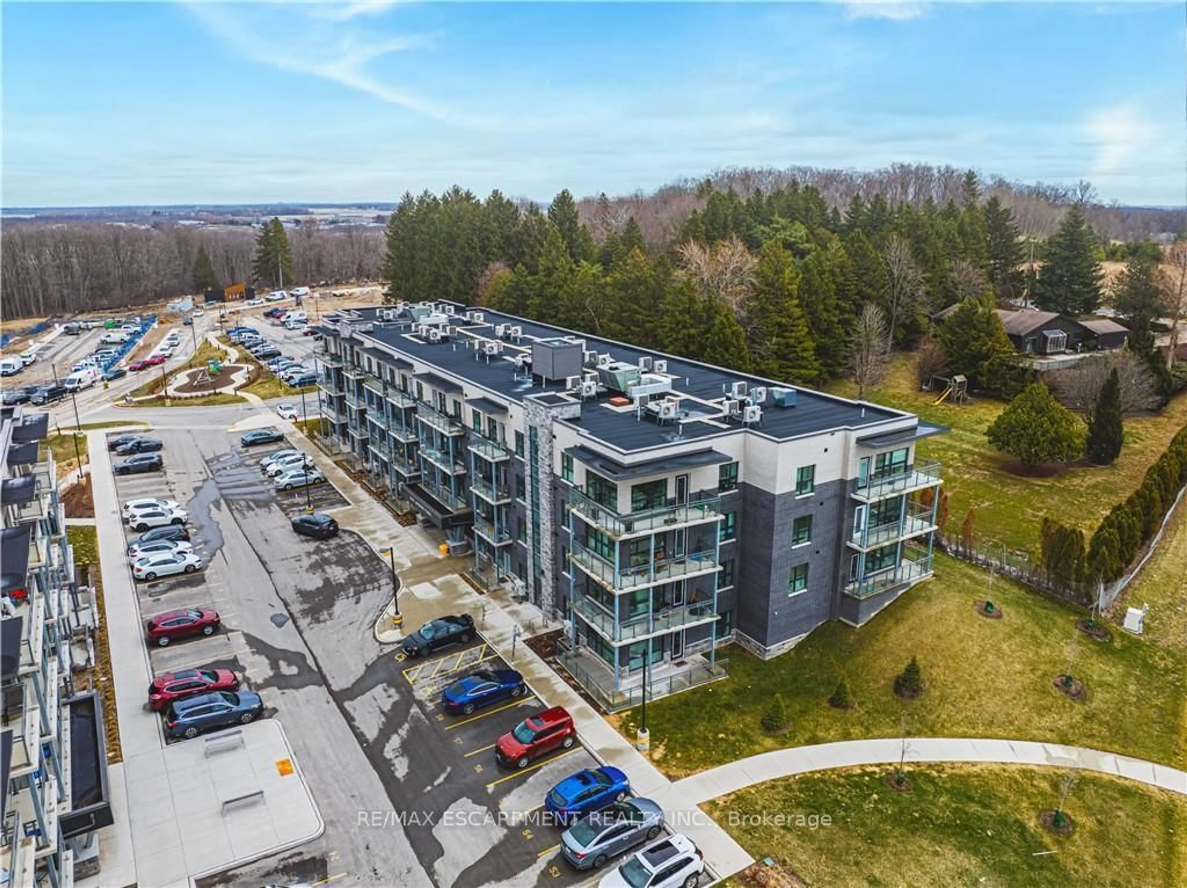 A pic from outside/outdoor area/front of a property/back of a property/a pic from drone, building for 1201 Lackner Pl #310, Kitchener Ontario N2A 0L4