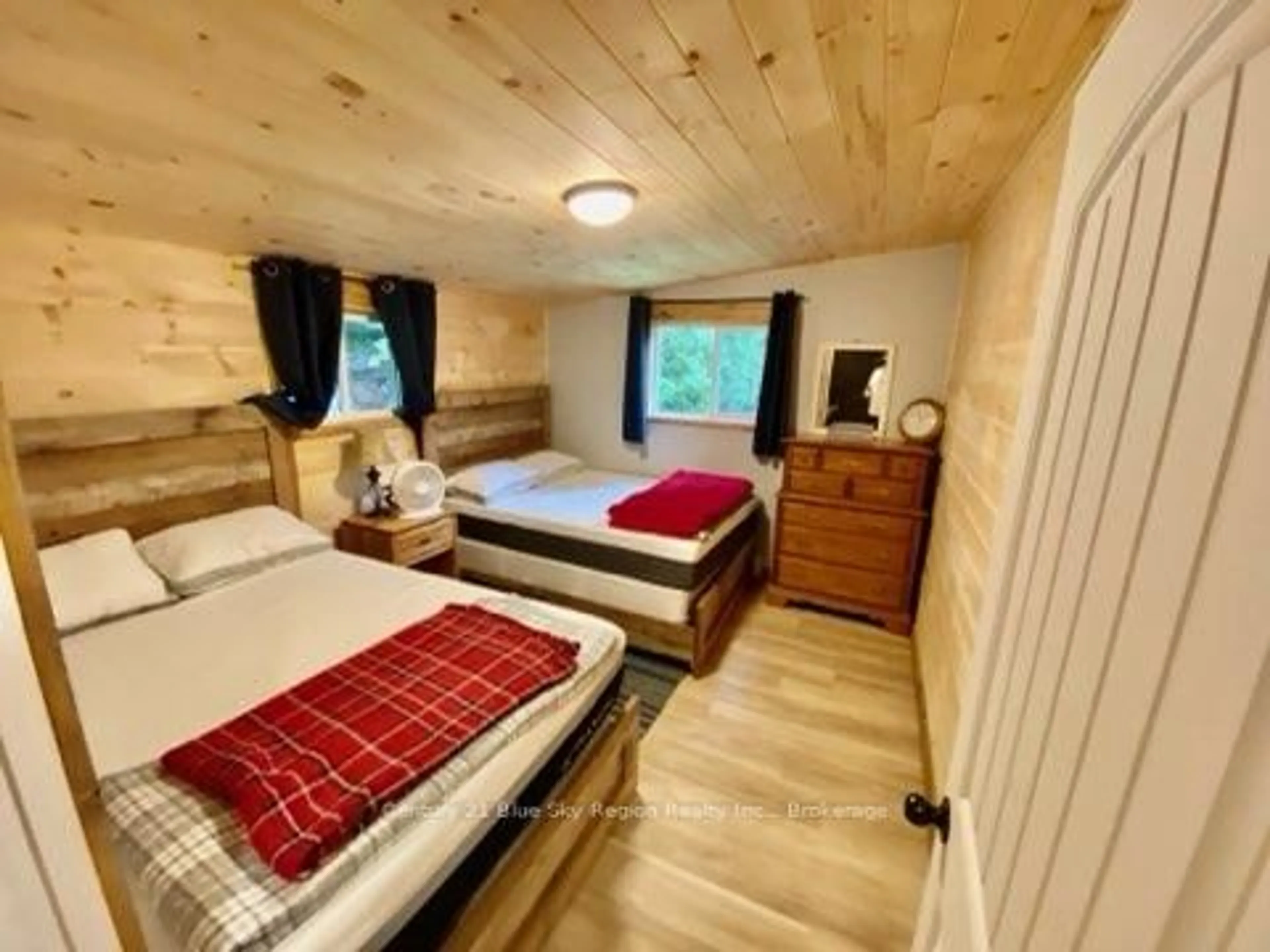 Bedroom with bed, wood/laminate floor for 75 Richfield Rd, Temagami Ontario P0H 1T0
