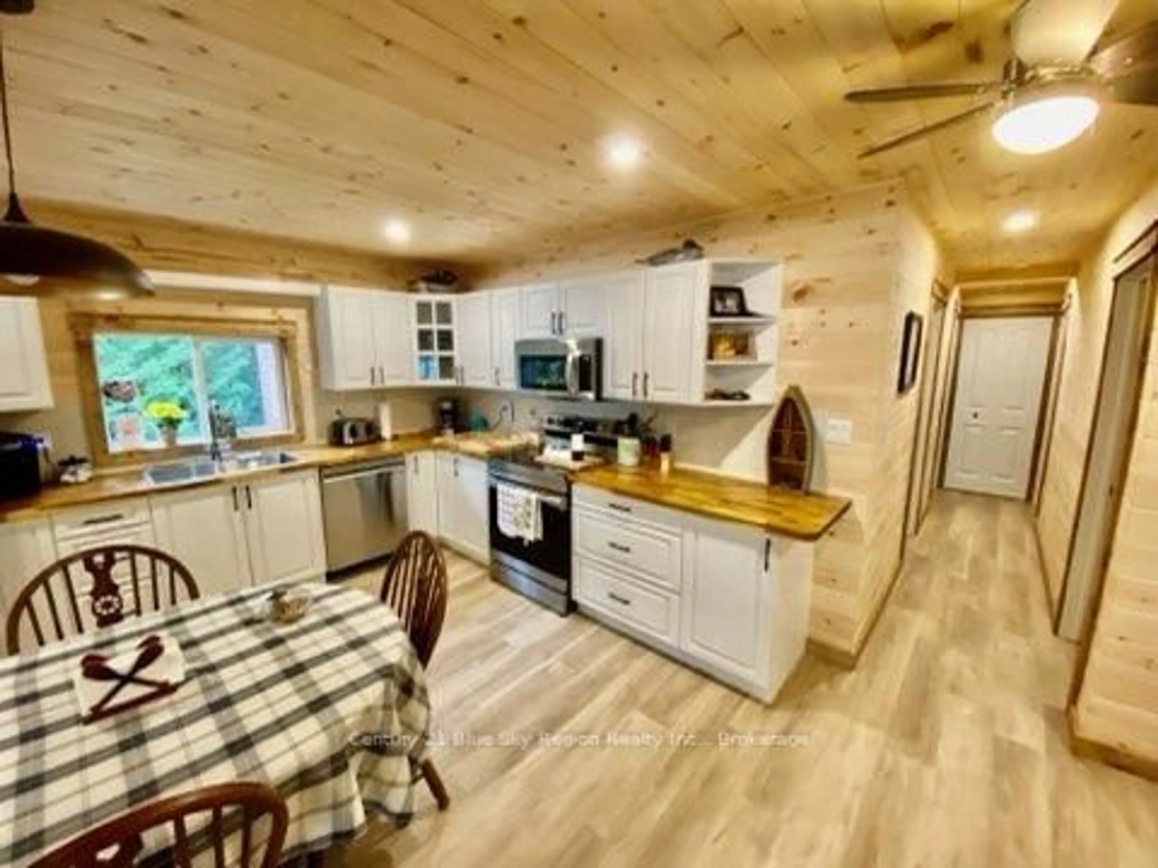 Open concept kitchen, wood/laminate floor for 75 Richfield Rd, Temagami Ontario P0H 1T0