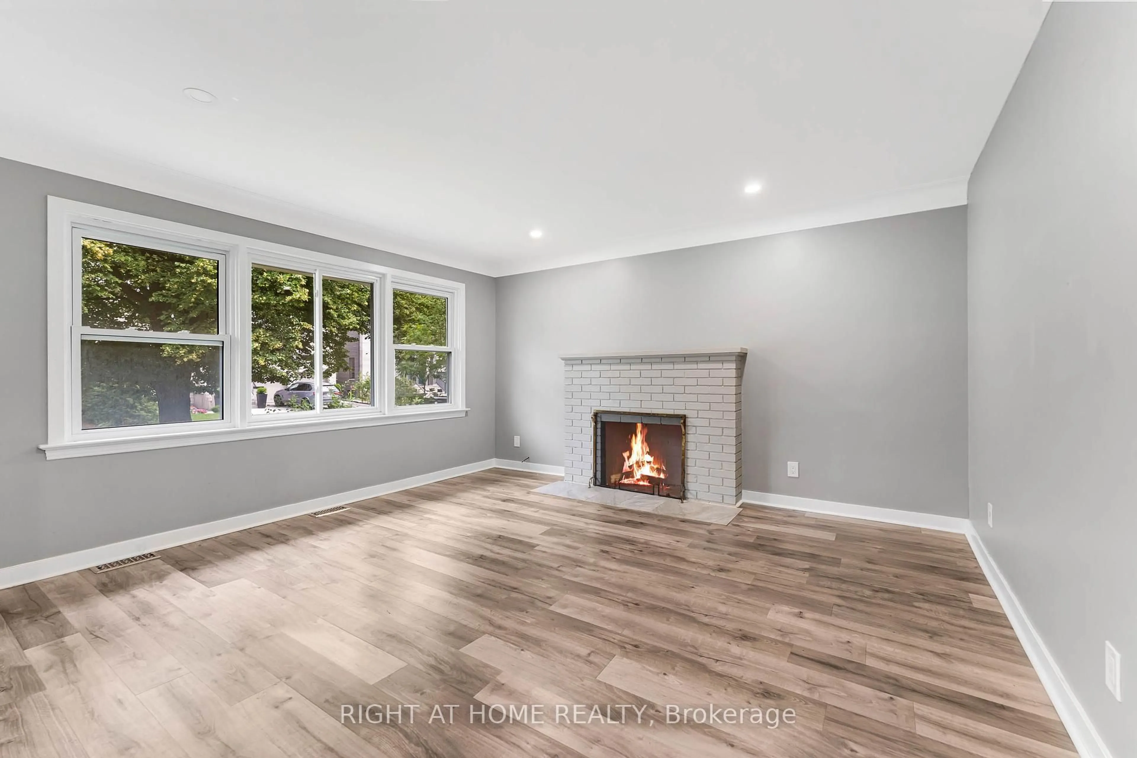 Living room with furniture, wood/laminate floor for 2216 Prospect Ave, Ottawa Ontario K1H 7G3