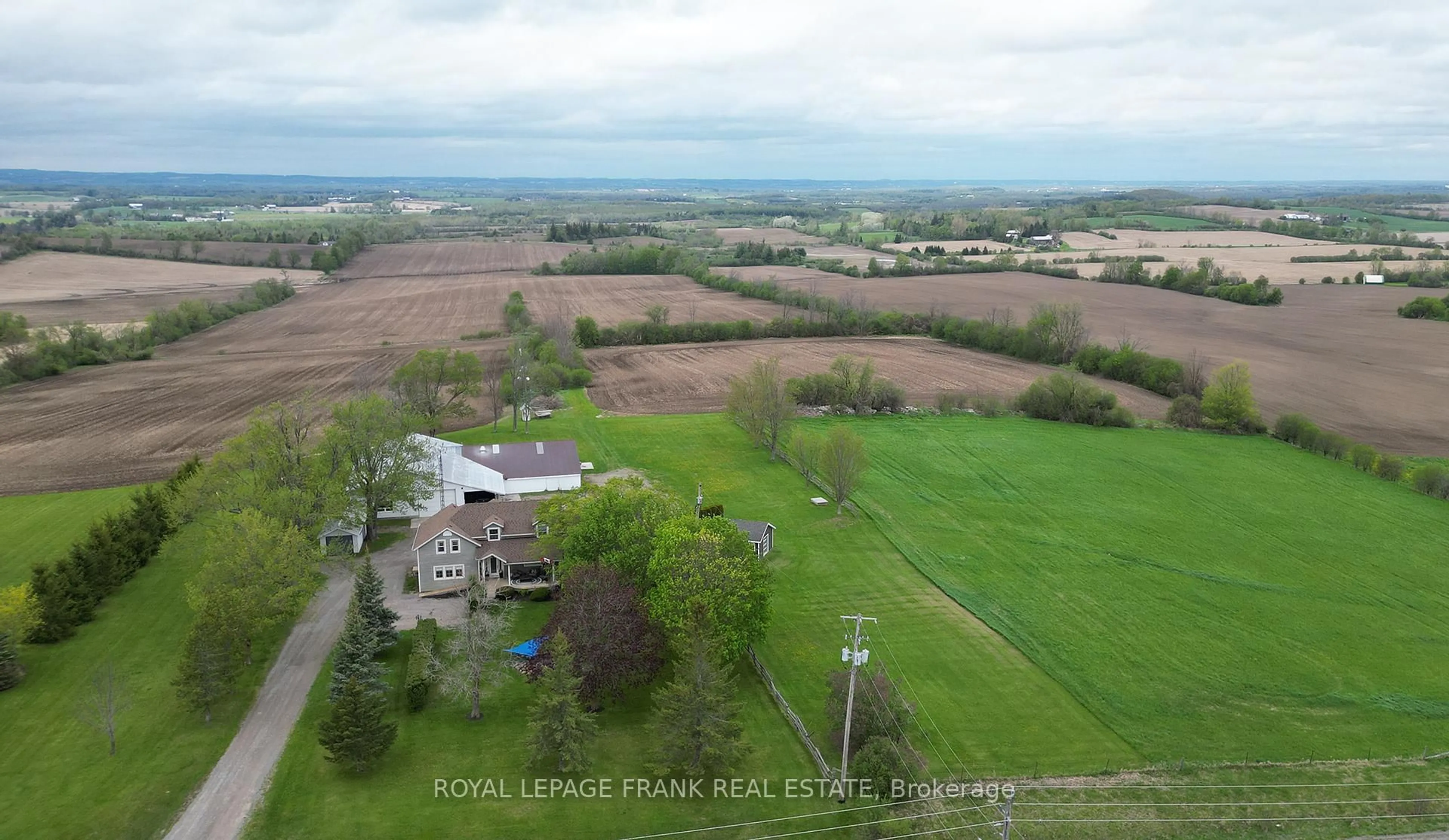 A pic from outside/outdoor area/front of a property/back of a property/a pic from drone, mountain view for 100 County 2 Rd, Otonabee-South Monaghan Ontario K0L 1B0