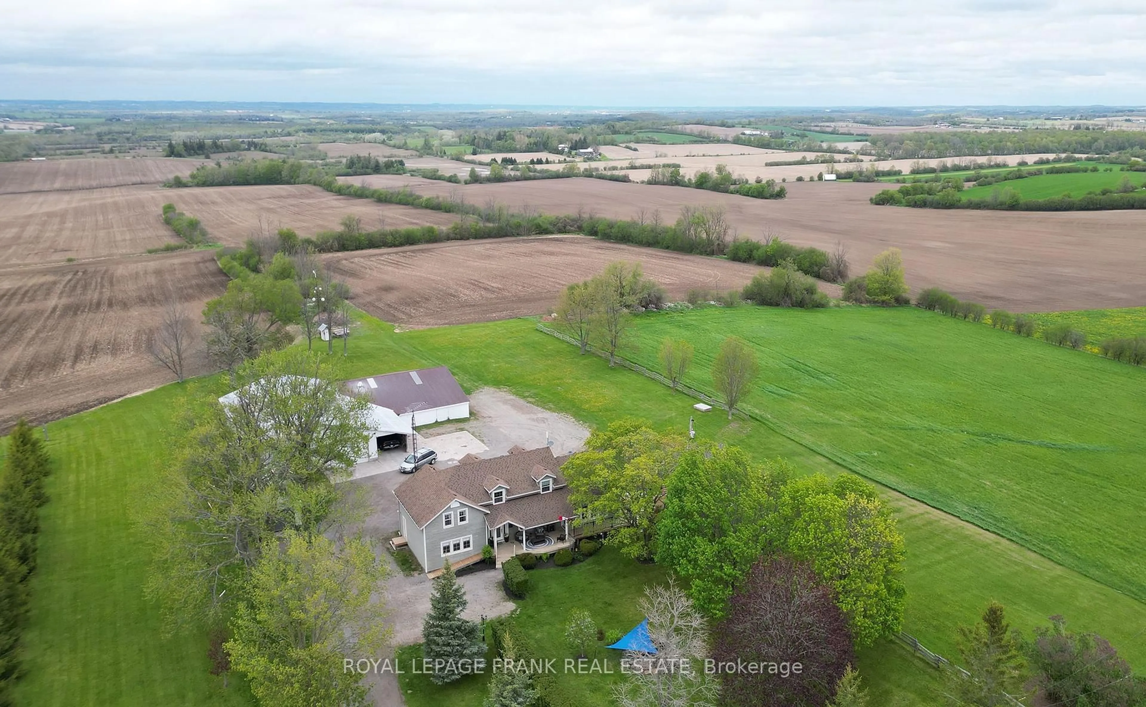 A pic from outside/outdoor area/front of a property/back of a property/a pic from drone, mountain view for 100 County 2 Rd, Otonabee-South Monaghan Ontario K0L 1B0