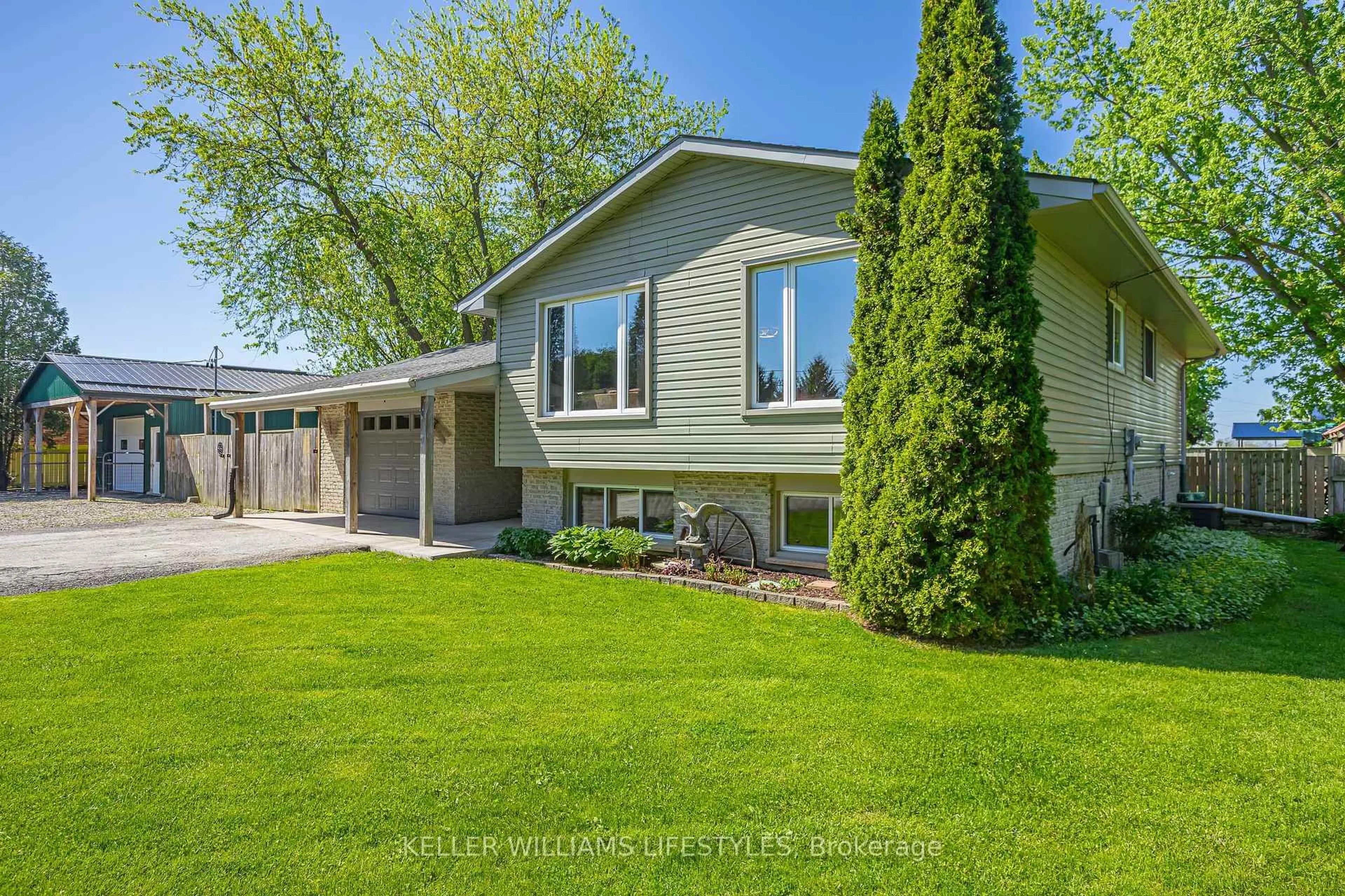 Home with vinyl exterior material, street for 3 East Williams St, North Middlesex Ontario N0M 1A0