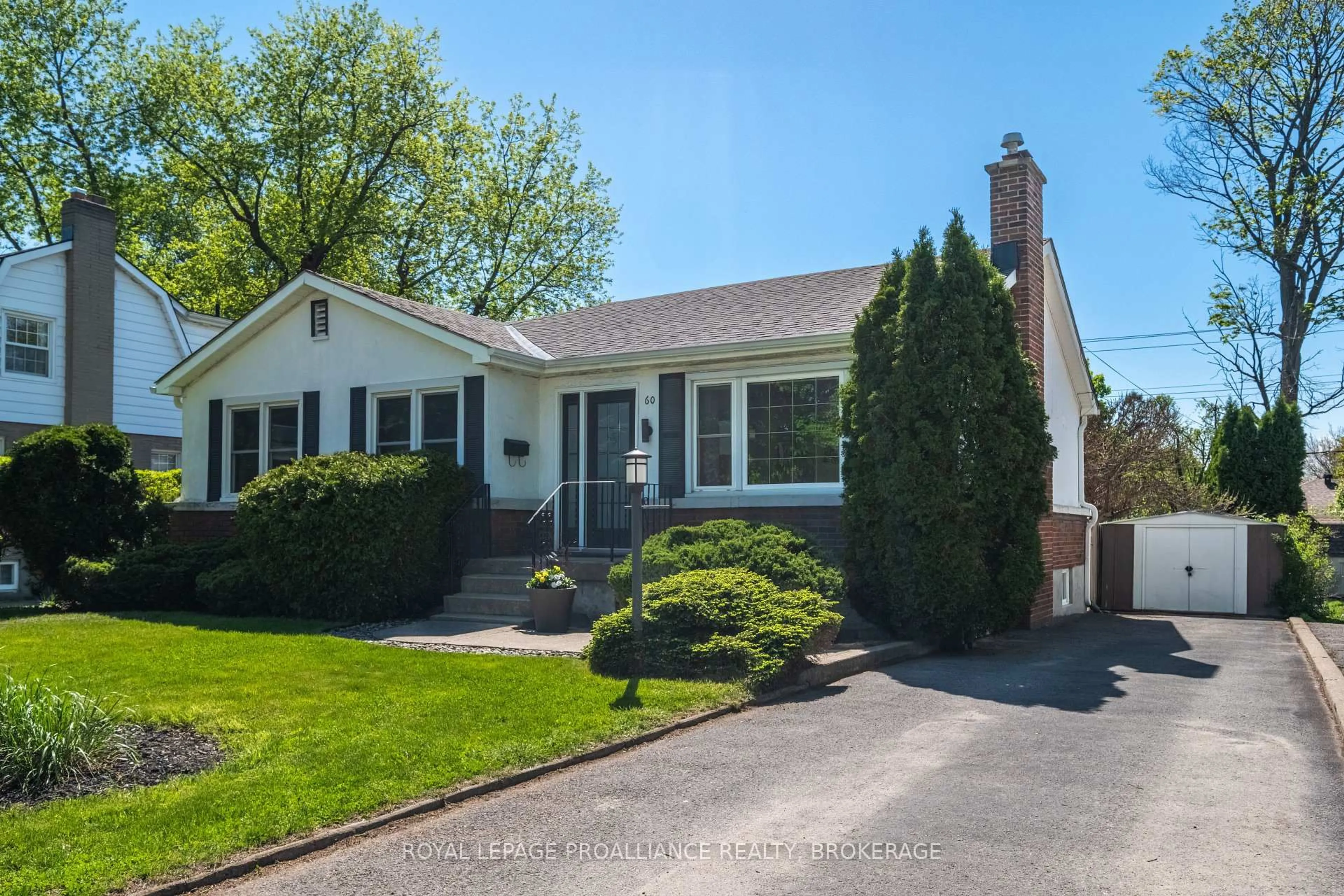 Home with vinyl exterior material, street for 60 Westmoreland Rd, Kingston Ontario K7M 1J5