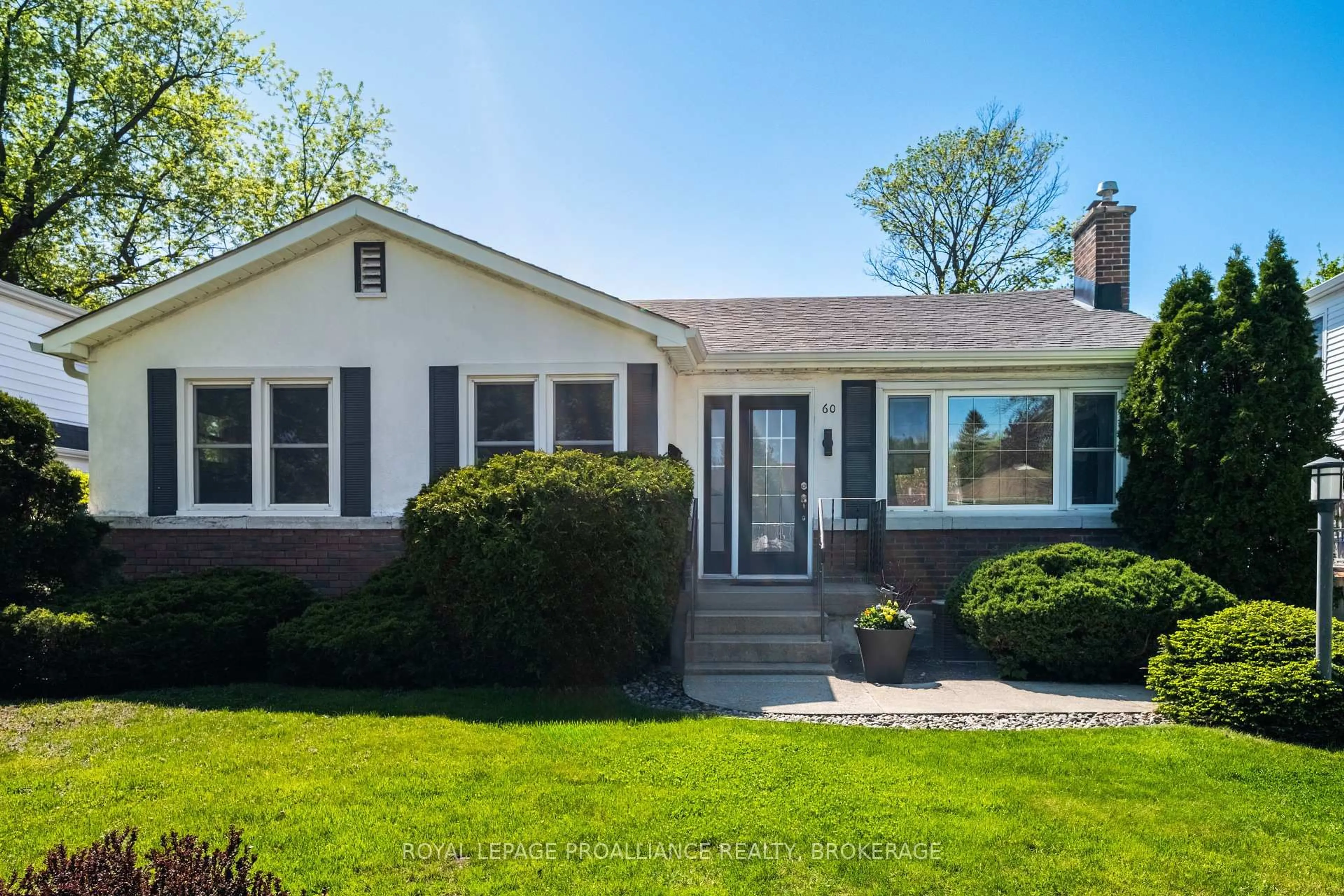 Home with vinyl exterior material, street for 60 Westmoreland Rd, Kingston Ontario K7M 1J5