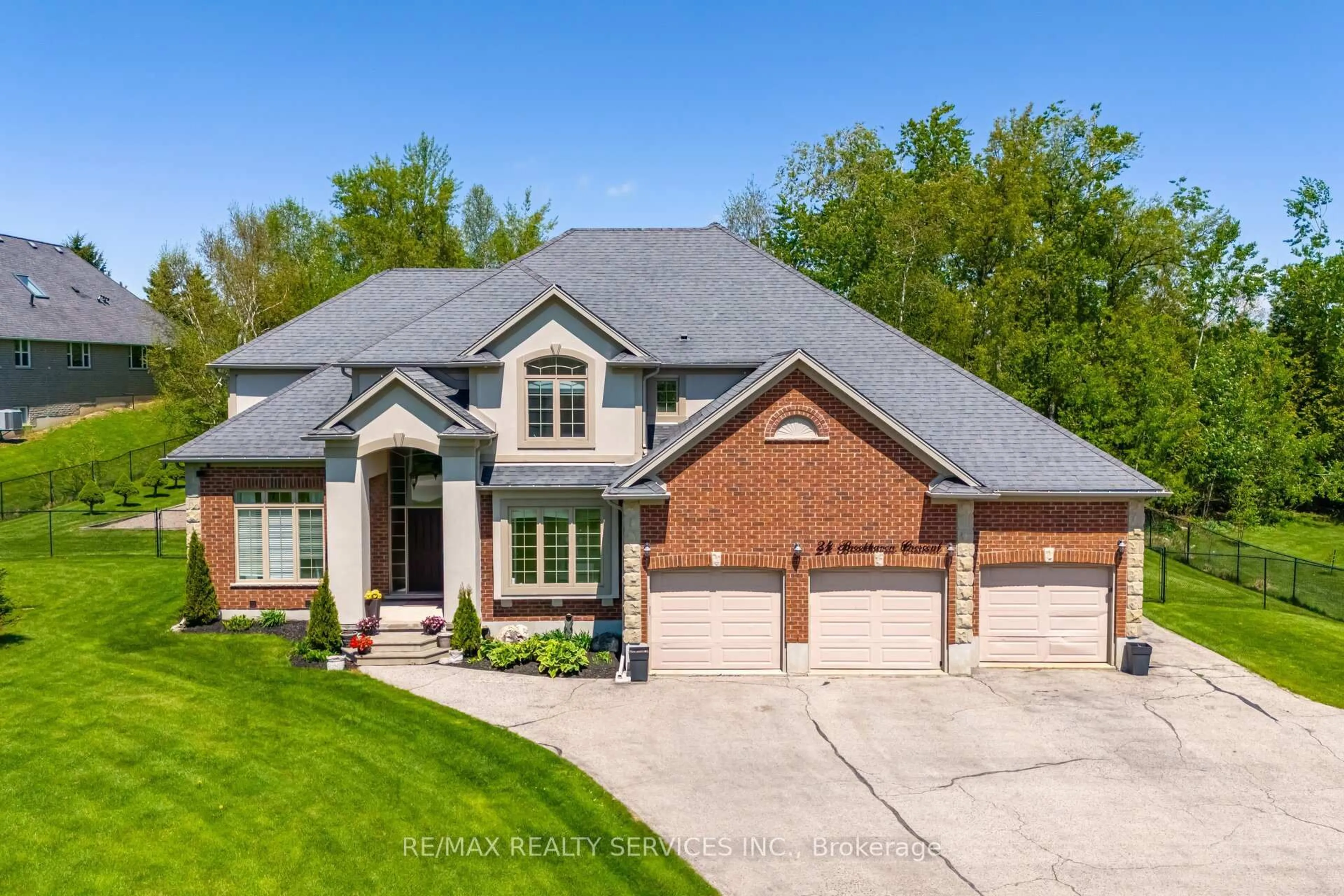 Home with brick exterior material, street for 24 Brookhaven Cres, East Garafraxa Ontario L9W 7L9