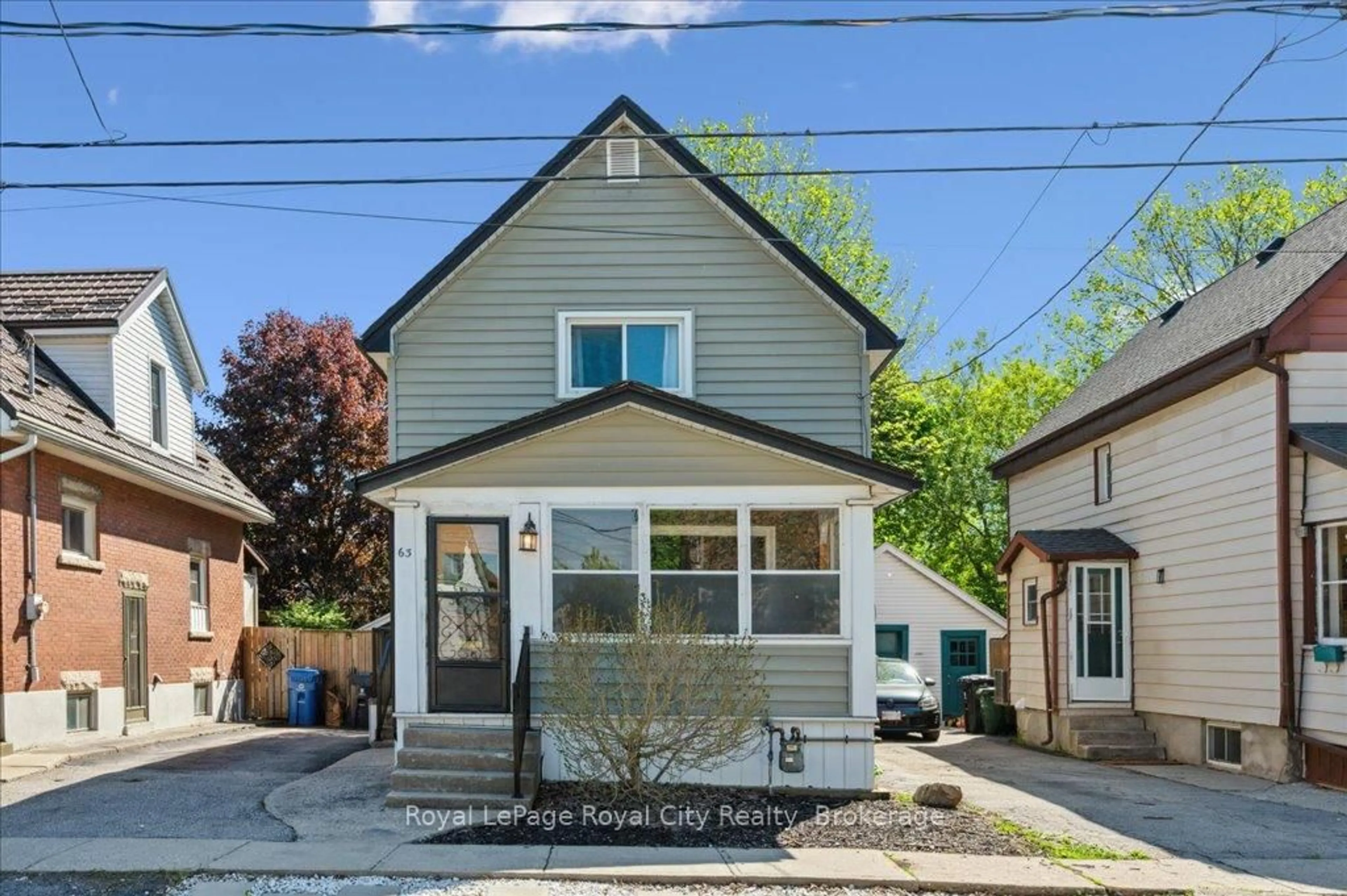 Home with vinyl exterior material, street for 63 Audrey Ave, Guelph Ontario N1E 5Y1